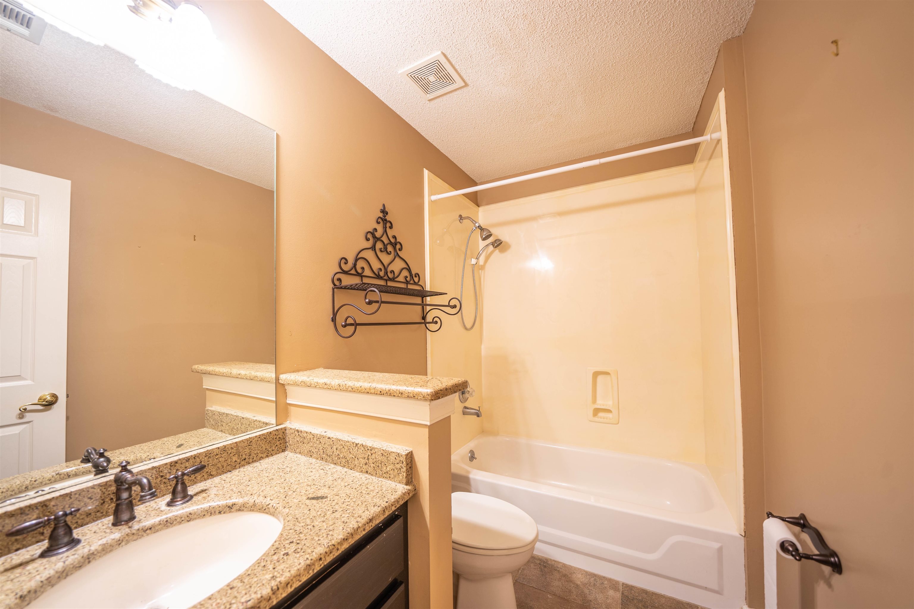 110 Fisherville Road Collierville, TN 38017 - Photo 13 of 21 a bathroom with a granite countertop sink toilet and shower