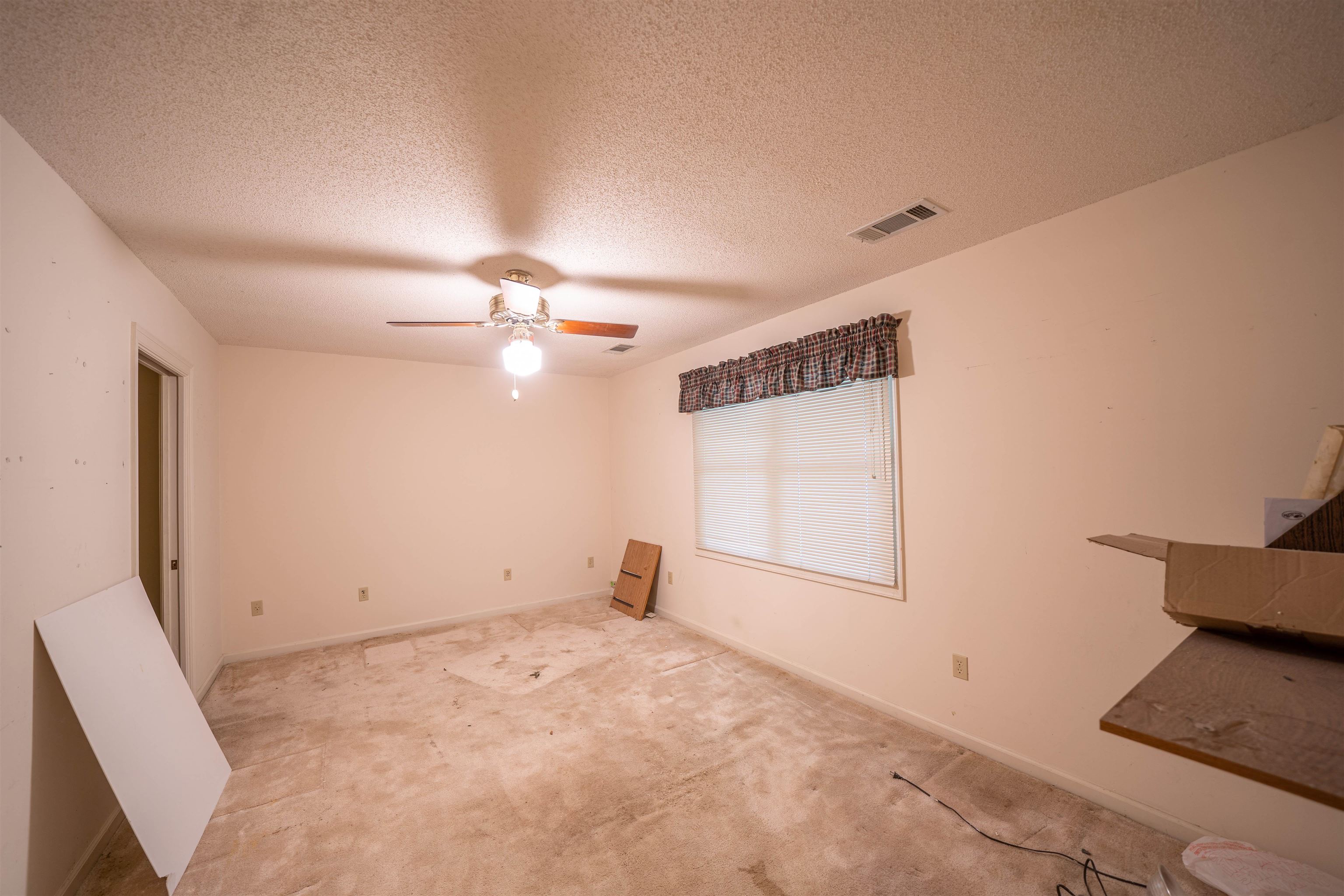 110 Fisherville Road Collierville, TN 38017 - Photo 14 of 21 an empty room with chandelier fan and windows