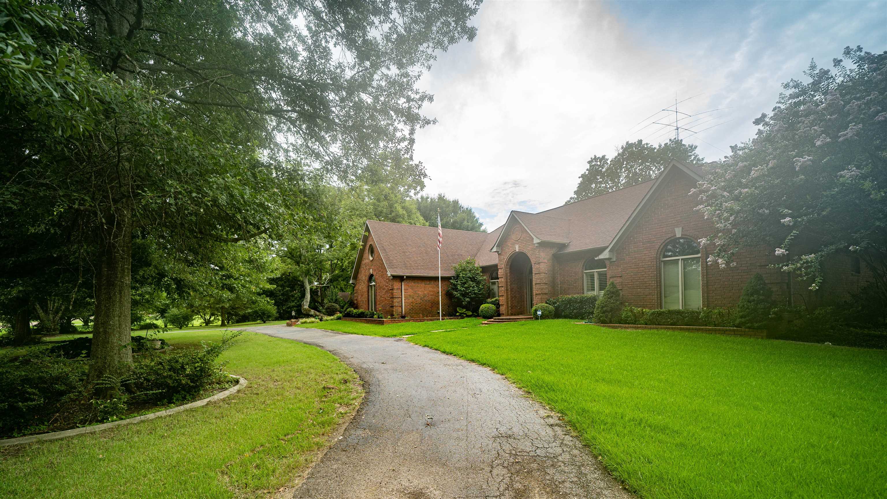 110 Fisherville Road Collierville, TN 38017 - Photo 19 of 21 a view of a white house in front of a big yard with large trees