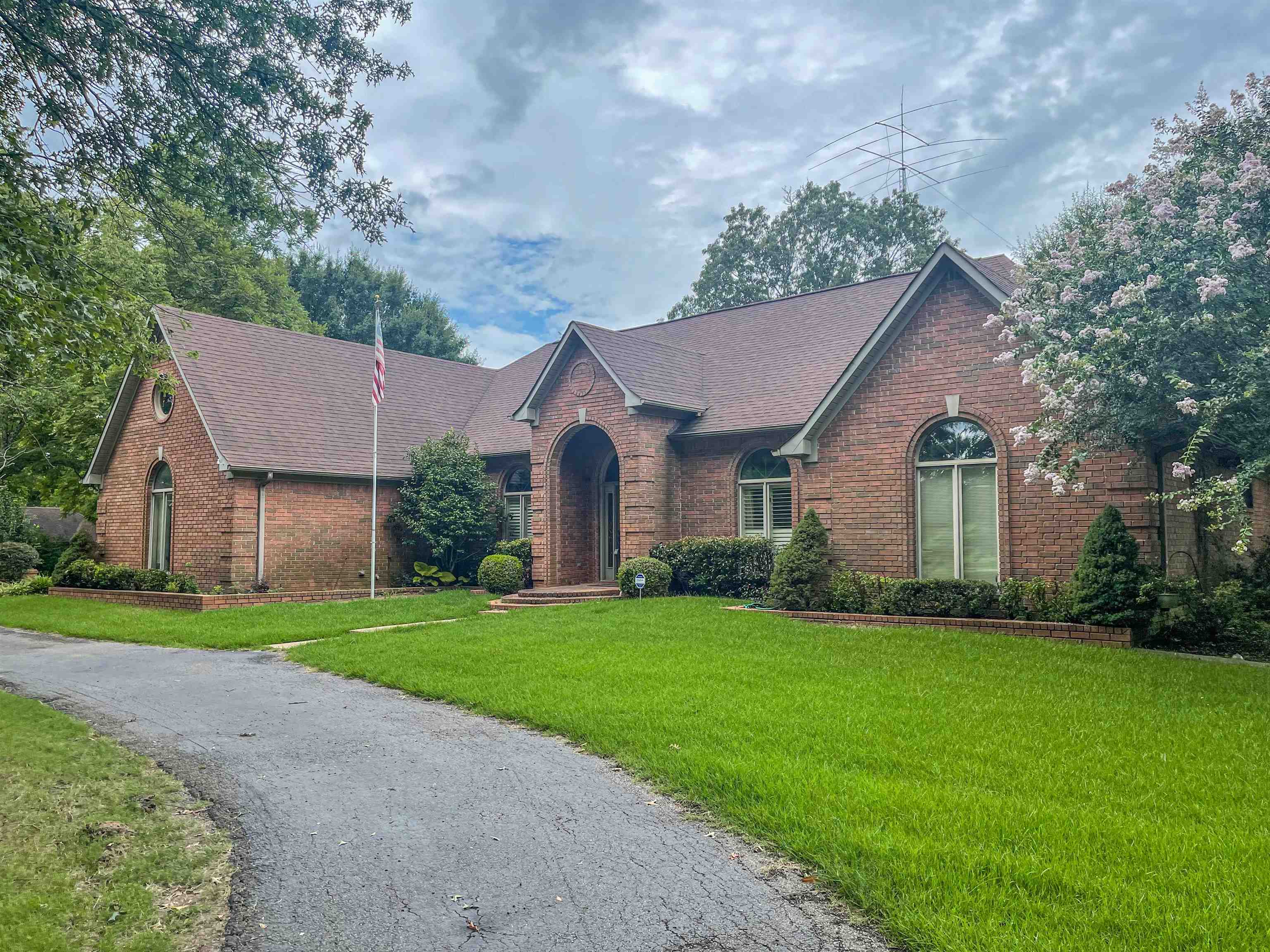 110 Fisherville Road Collierville, TN 38017 - Photo 2 of 21 a front view of a house with a yard and garage