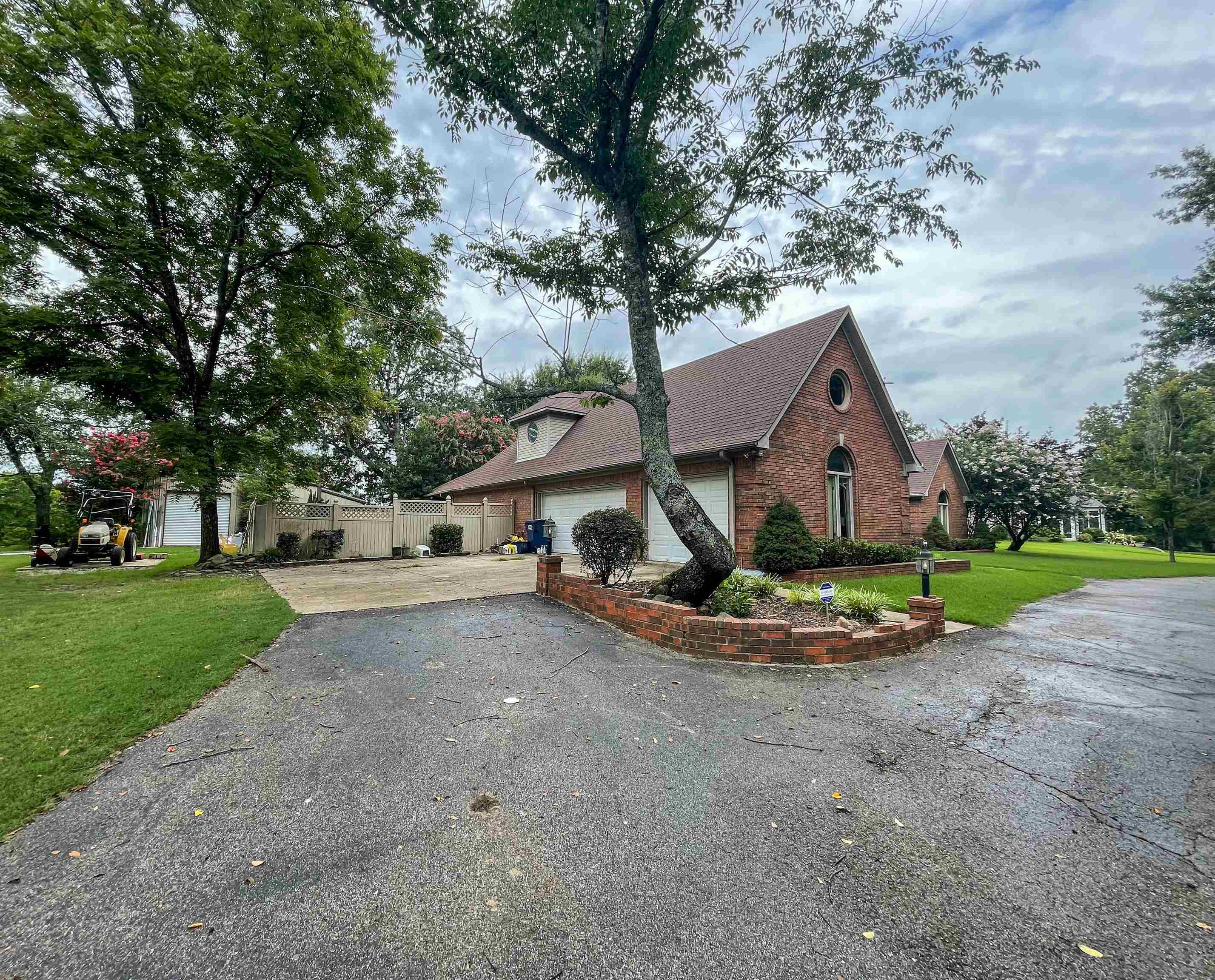 110 Fisherville Road Collierville, TN 38017 - Photo 3 of 21 a front view of a house with a yard and garage