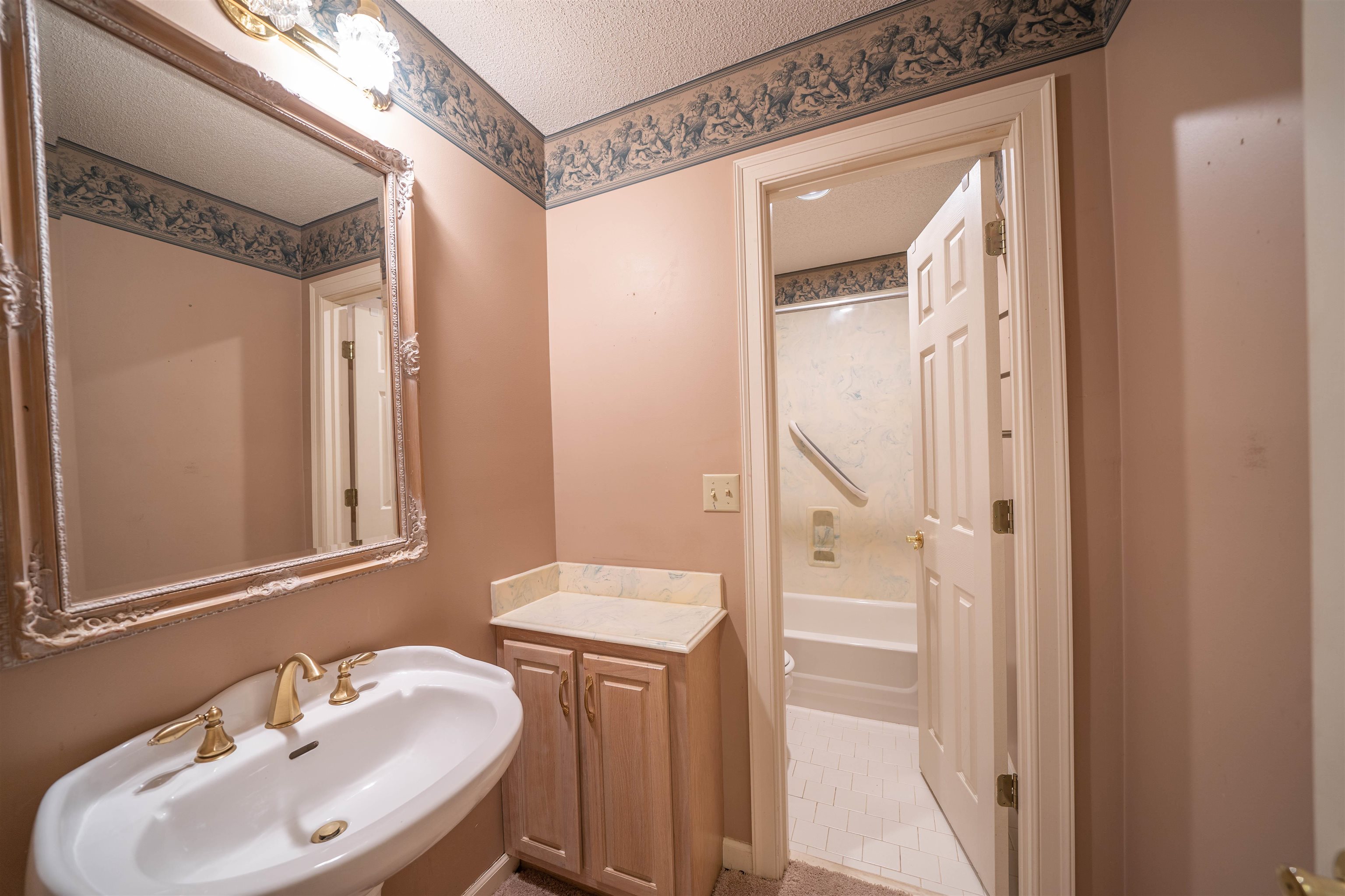 110 Fisherville Road Collierville, TN 38017 - Photo 5 of 21 a bathroom with a sink a toilet and a mirror