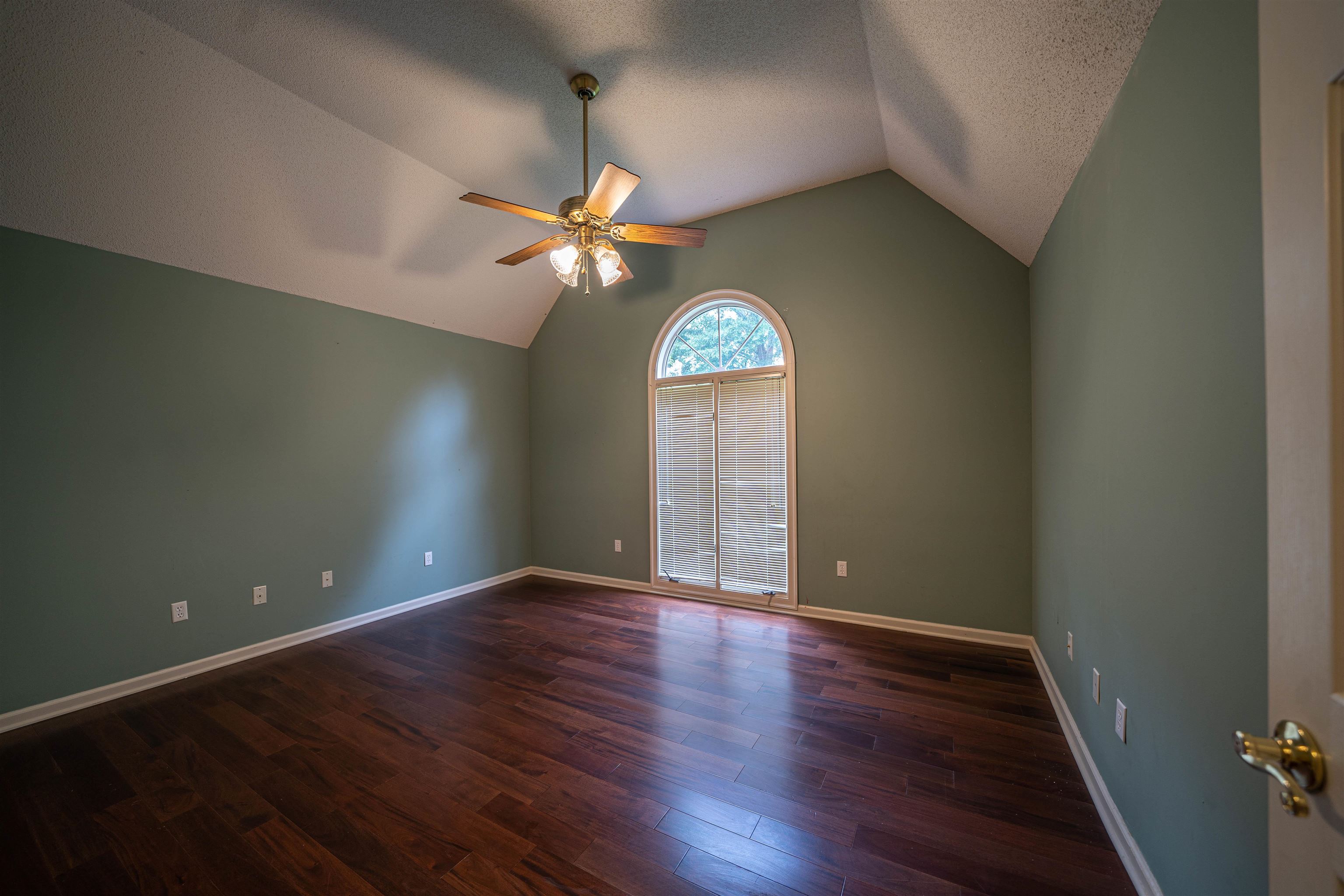 110 Fisherville Road Collierville, TN 38017 - Photo 6 of 21 an empty room with wooden floor chandelier fan and windows