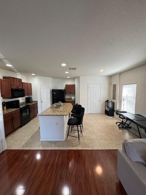 4632 Chatterton Way Riverview, FL 33578 - Photo 6 of 13 a living room with furniture and kitchen view