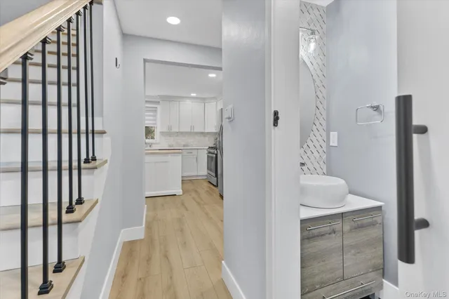 a bathroom with a sink and a mirror
