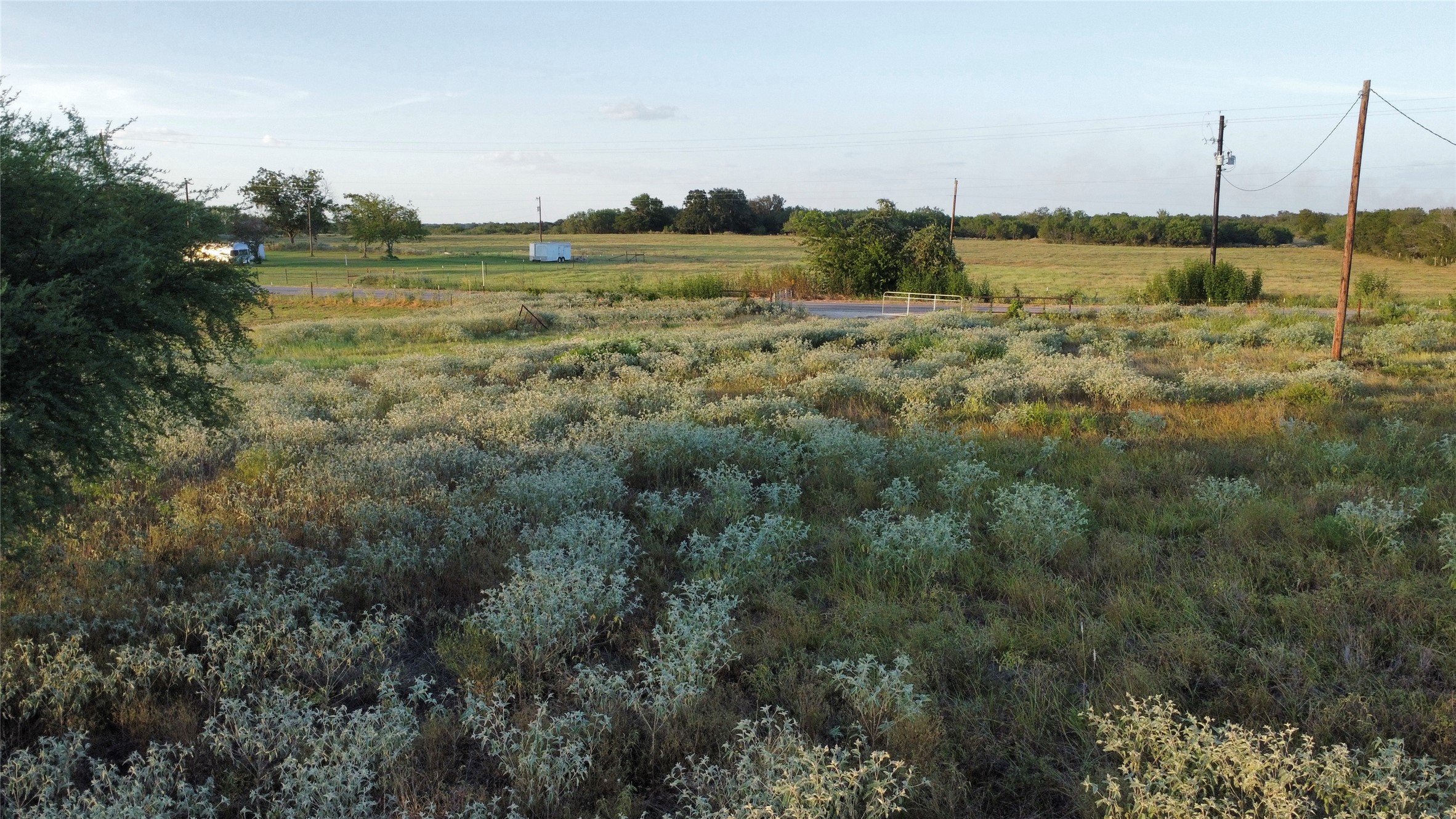 6447 Gander Slough Road Kingsbury, TX 78638 - Photo 6 of 16 Natural vegetation covers this open acreage under a vast sky.
