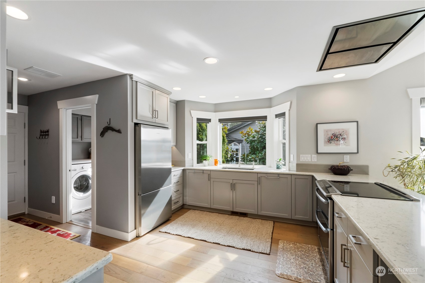52 Chapman Loop, Unit C Steilacoom, WA 98388 - Photo 21 of 40 a kitchen with a sink and refrigerator