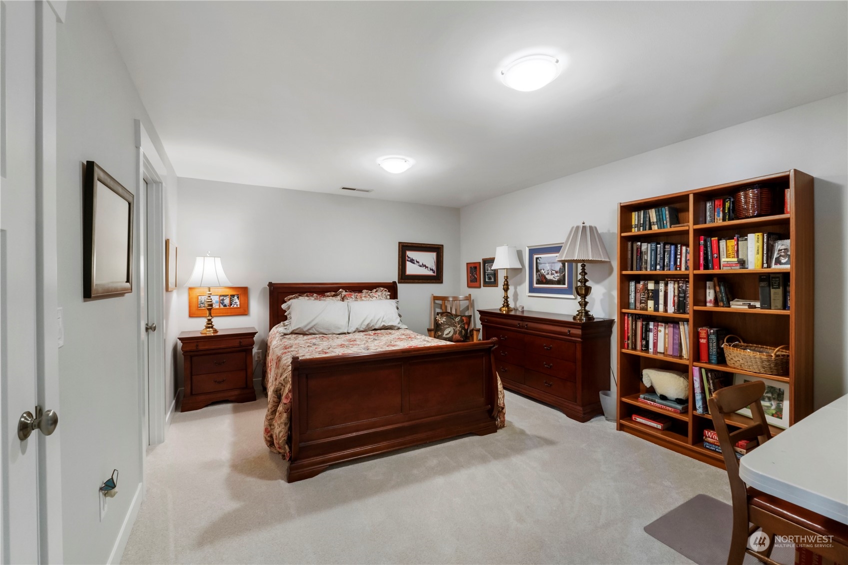 52 Chapman Loop, Unit C Steilacoom, WA 98388 - Photo 35 of 40 a bed room with a bed and a book shelf