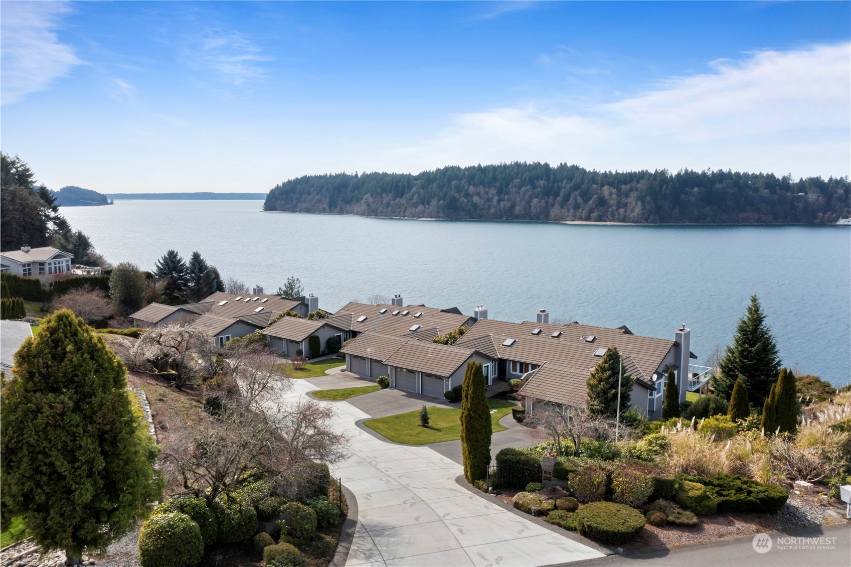 52 Chapman Loop, Unit C Steilacoom, WA 98388 - Photo 5 of 40 a picture of a lake with houses in the back