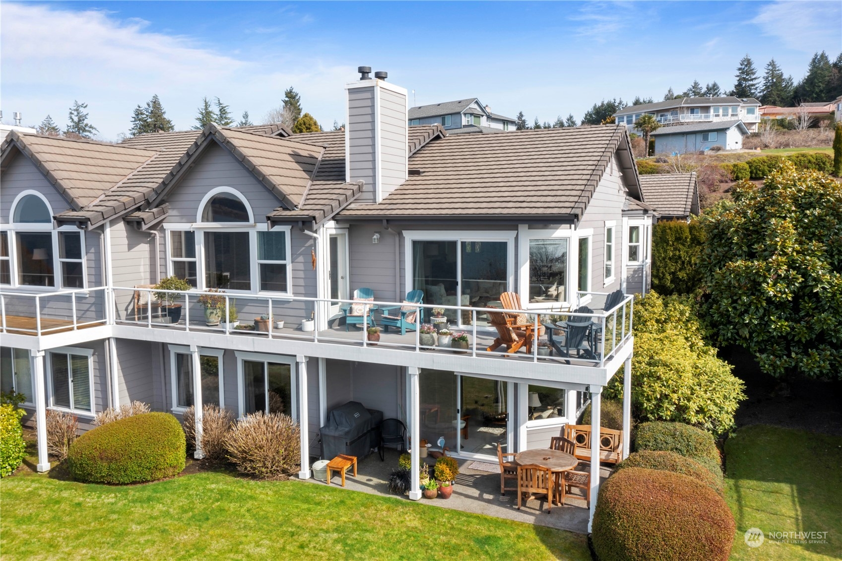 52 Chapman Loop, Unit C Steilacoom, WA 98388 - Photo 10 of 40 a view of a house with a yard and sitting area