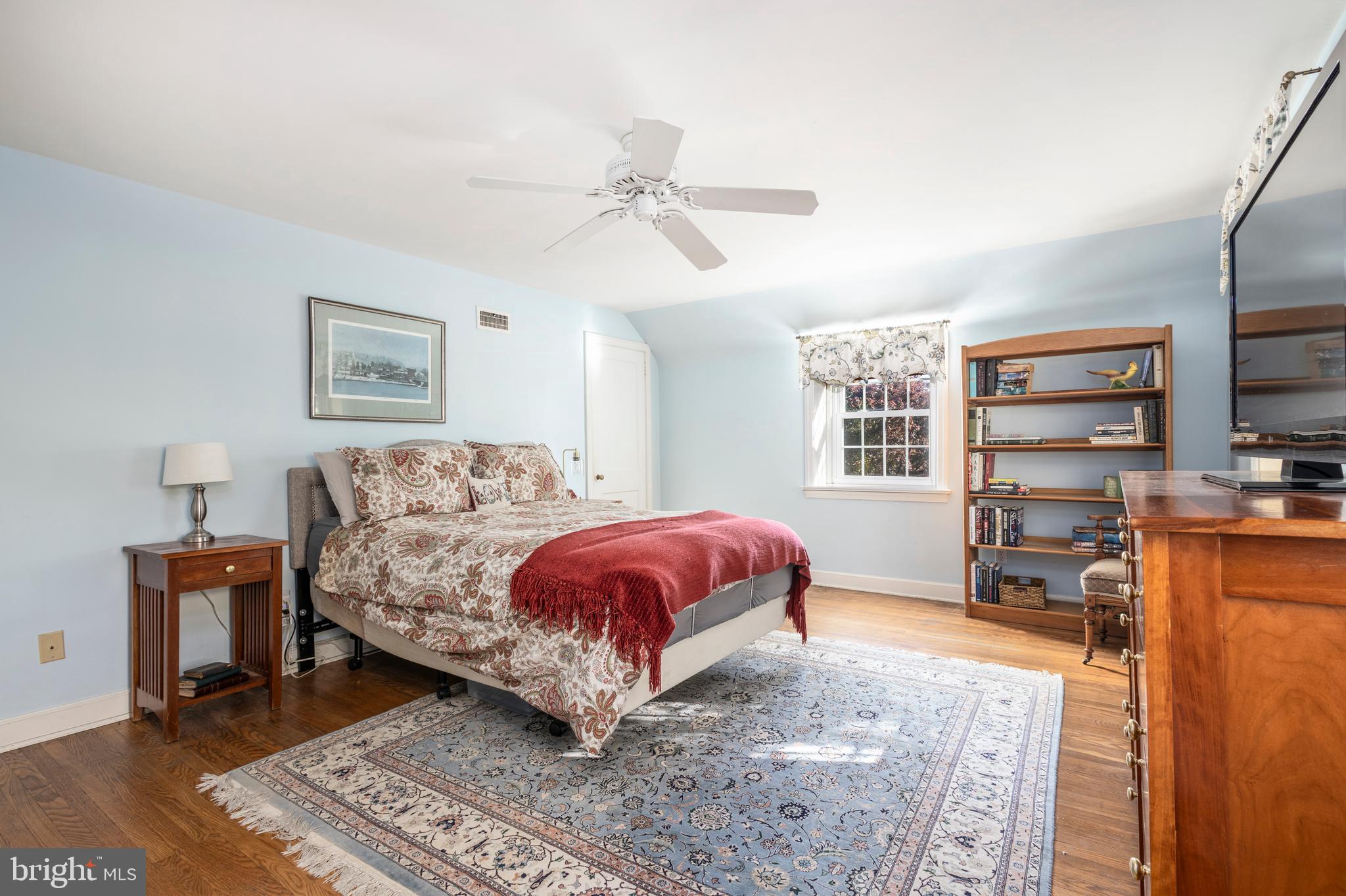 516 Beaver Road Glenside, PA 19038 - Photo 20 of 39 a bedroom with a large bed and a flat screen tv