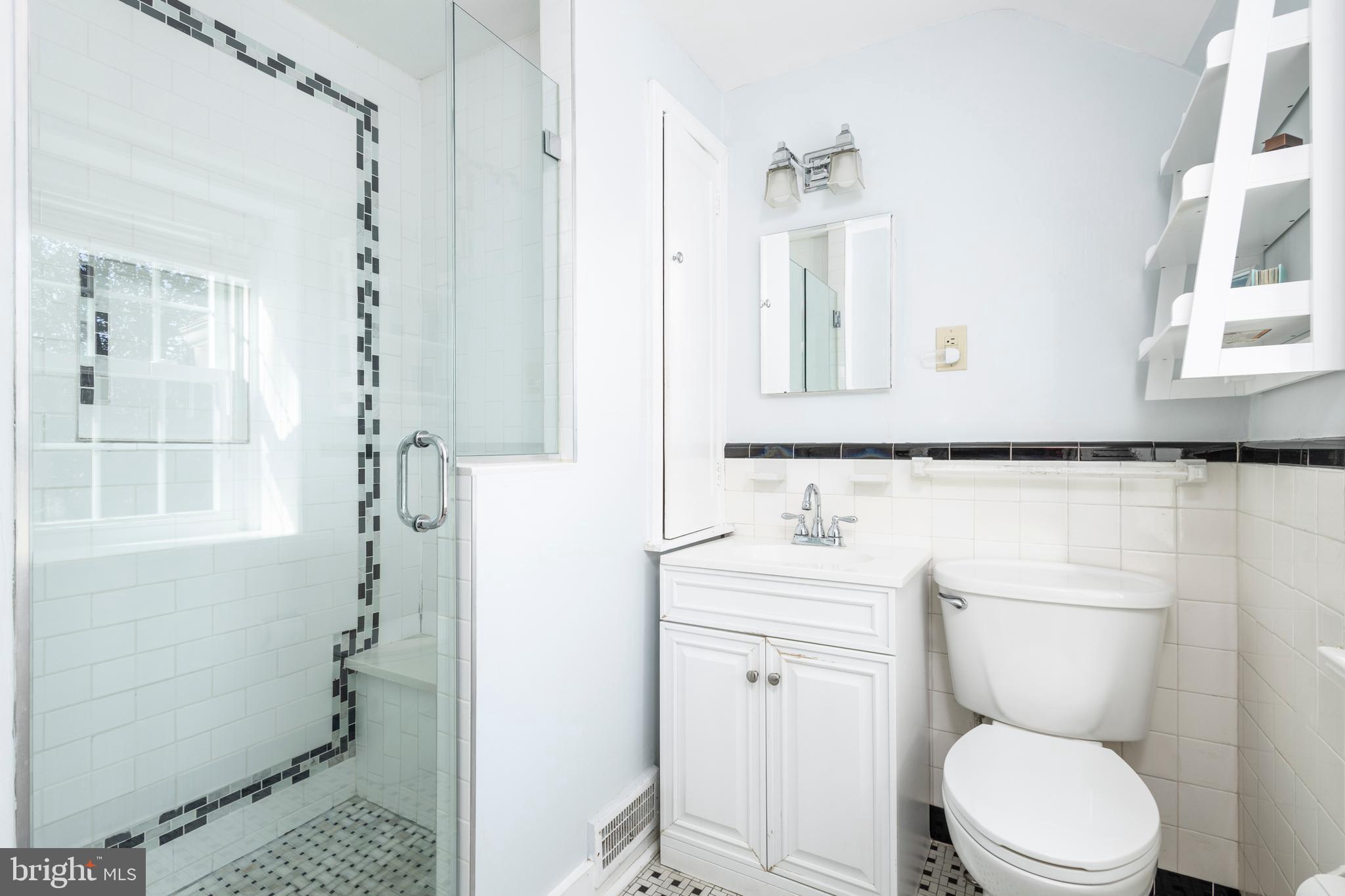 516 Beaver Road Glenside, PA 19038 - Photo 21 of 39 a bathroom with a toilet a sink and a mirror