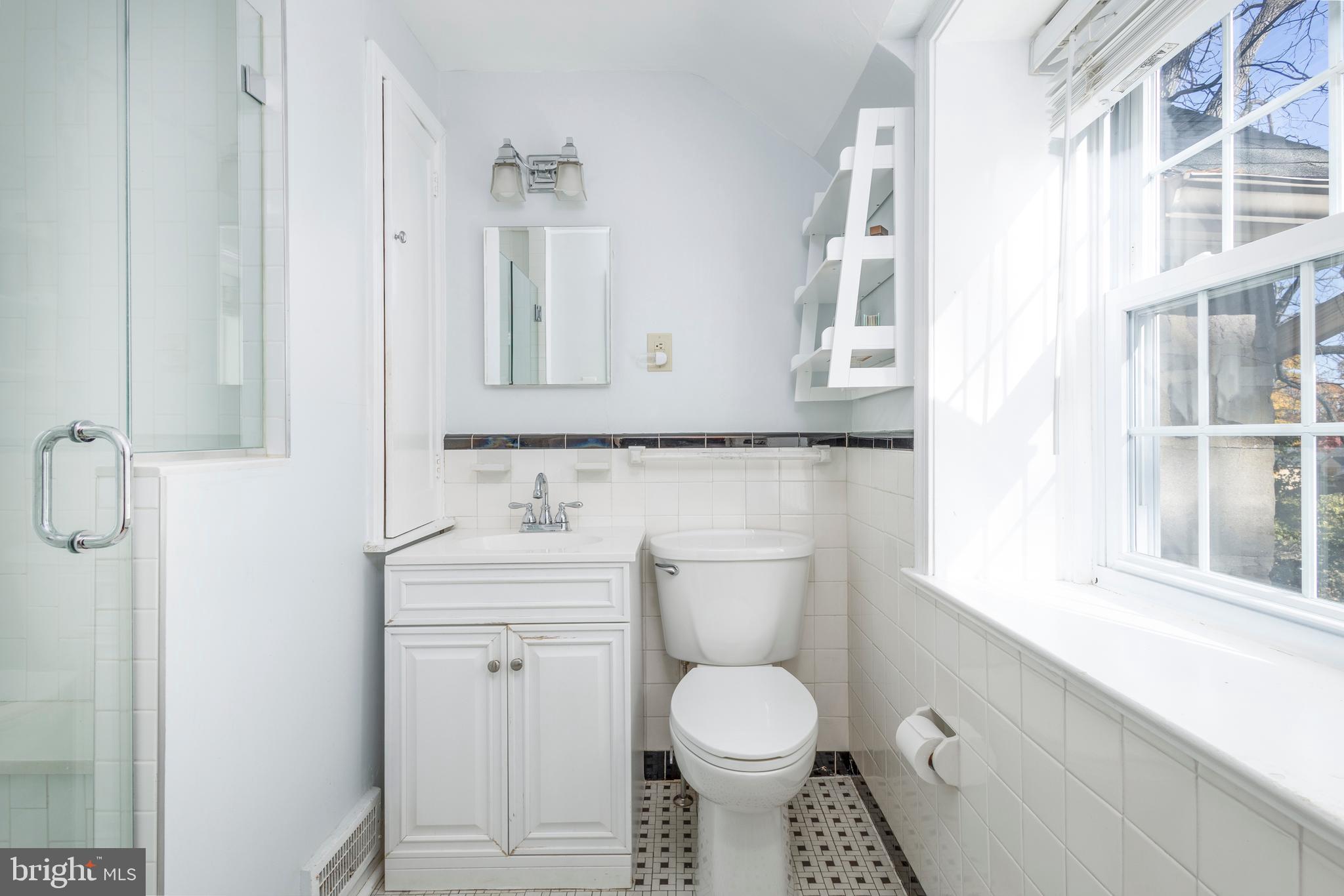 516 Beaver Road Glenside, PA 19038 - Photo 22 of 39 a bathroom with a toilet a sink and mirror