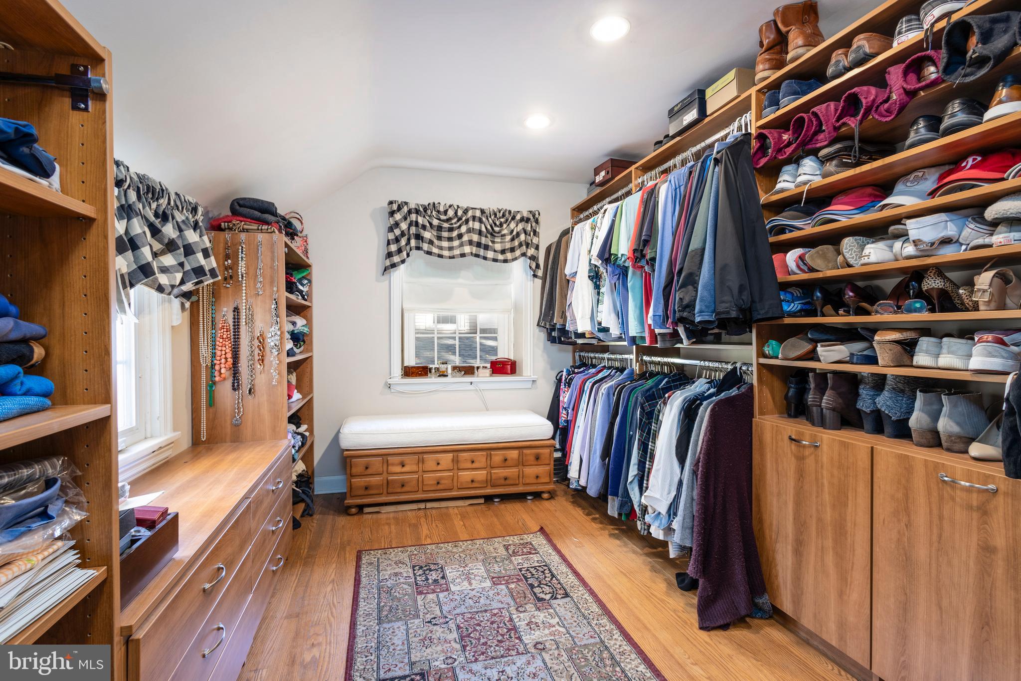 516 Beaver Road Glenside, PA 19038 - Photo 27 of 39 a view of walk in closet with clothes and shoes