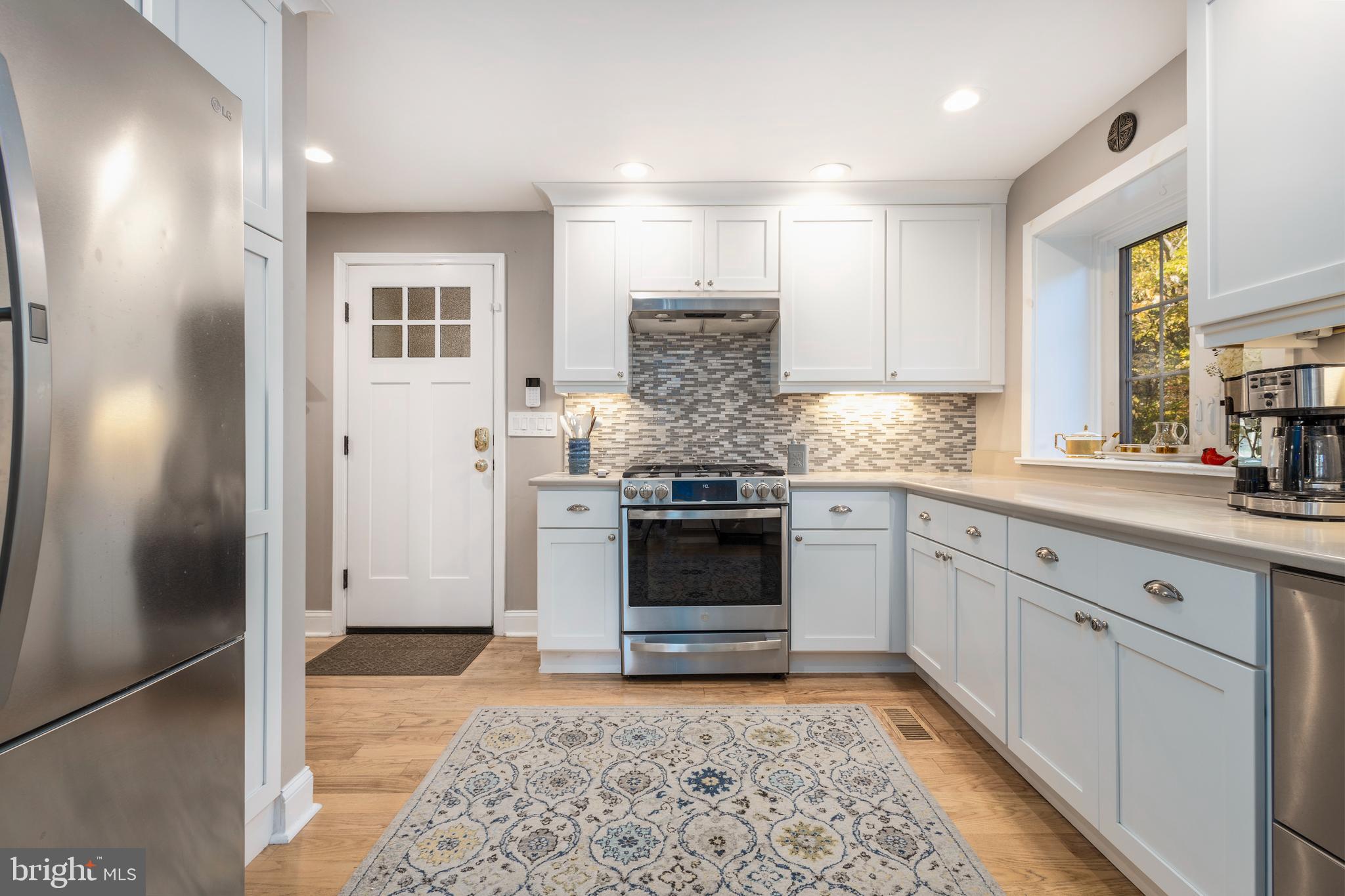 516 Beaver Road Glenside, PA 19038 - Photo 5 of 39 a kitchen with a refrigerator and a sink
