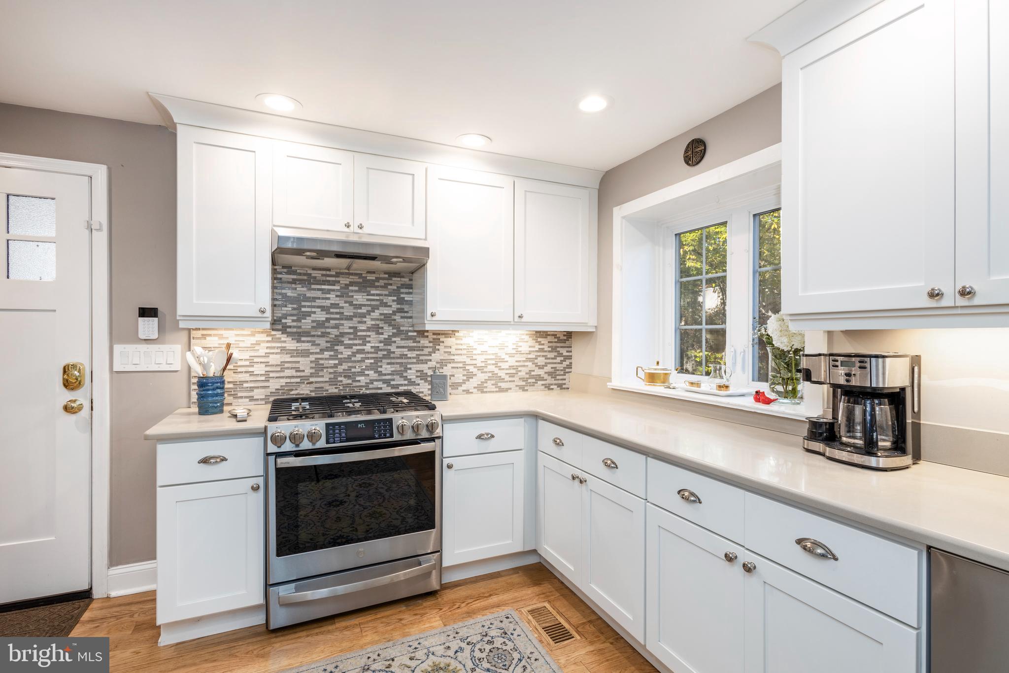 516 Beaver Road Glenside, PA 19038 - Photo 8 of 39 a kitchen with a stove and white cabinets
