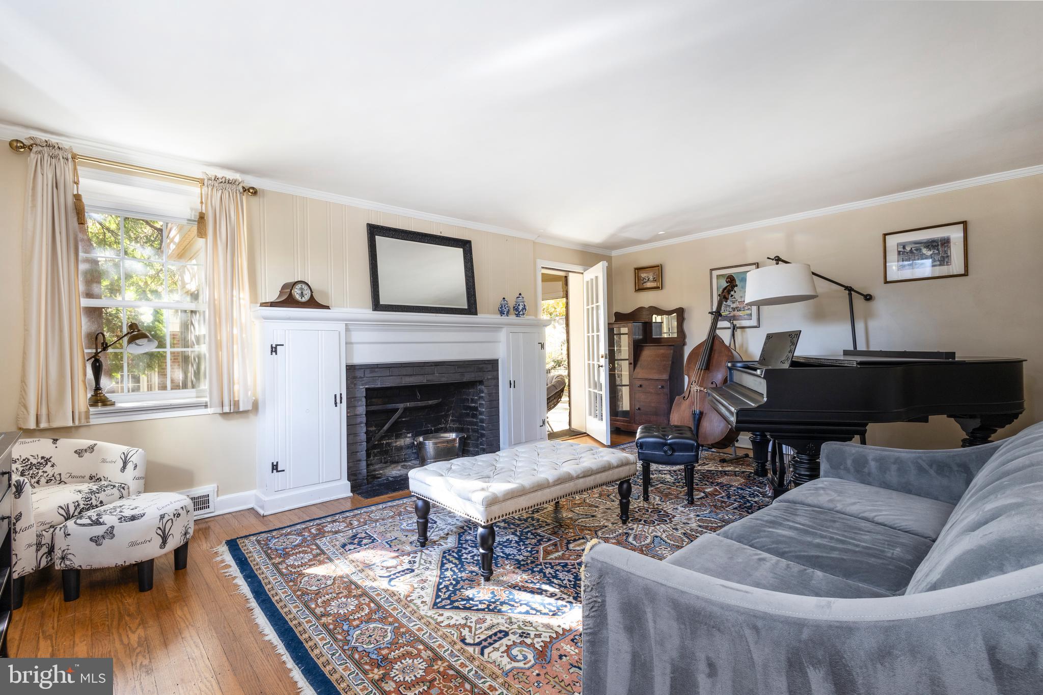 516 Beaver Road Glenside, PA 19038 - Photo 10 of 39 a living room with furniture and a fireplace