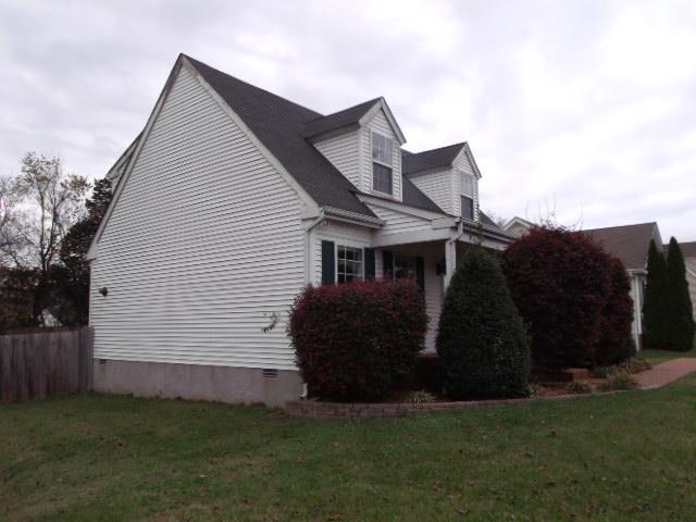 2833 Rippavilla Way Spring Hill, TN 37174 - Photo 3 of 16 a front view of a house with a garden