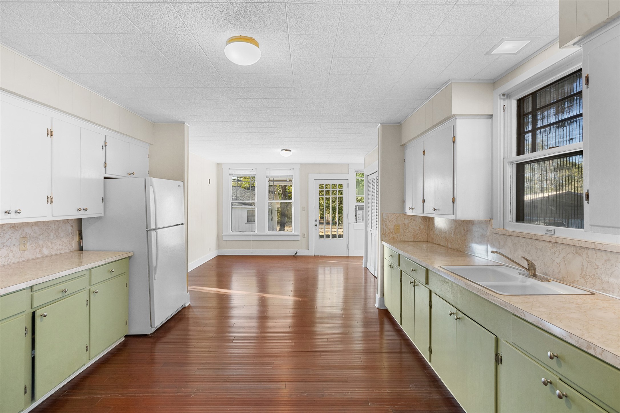 208 Summit Street Schulenburg, TX 78956 - Photo 12 of 26 a kitchen with stainless steel appliances granite countertop a sink stove and refrigerator