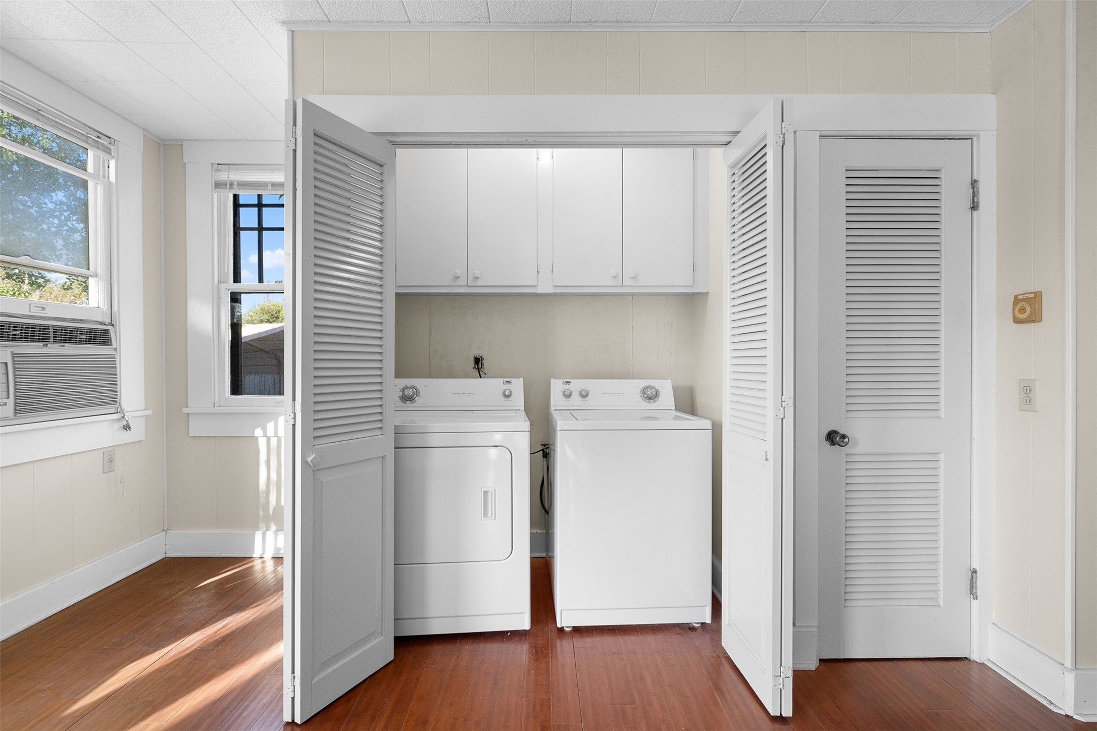 208 Summit Street Schulenburg, TX 78956 - Photo 15 of 26 a view of utility room with closet and wooden floor