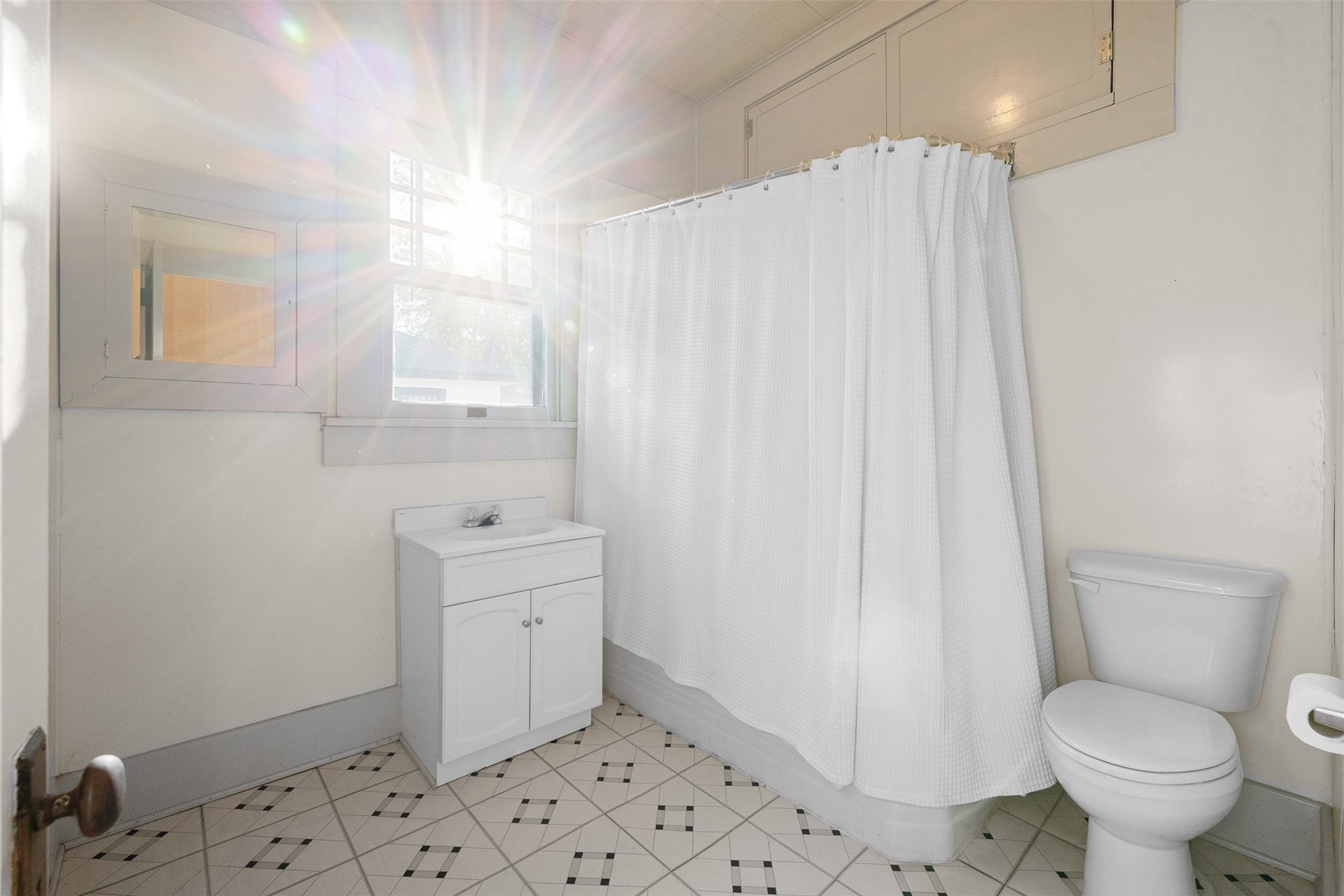 208 Summit Street Schulenburg, TX 78956 - Photo 19 of 26 a bathroom with a sink a toilet and shower
