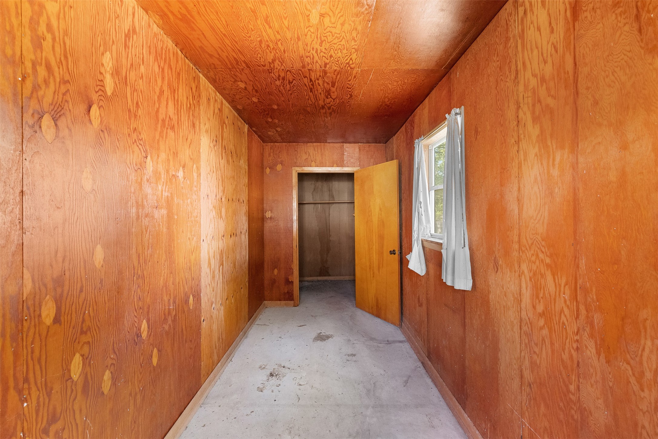 208 Summit Street Schulenburg, TX 78956 - Photo 22 of 26 a view of a hallway with wooden shelves