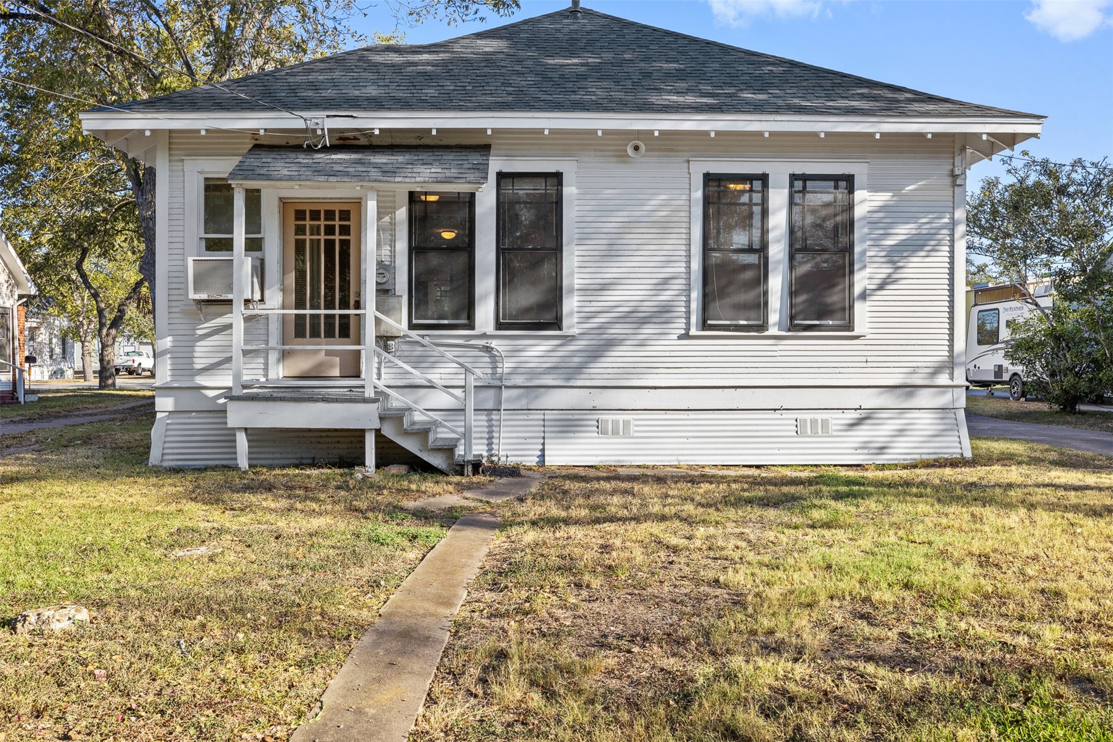 208 Summit Street Schulenburg, TX 78956 - Photo 23 of 26 a view of a house with swimming pool next to a yard