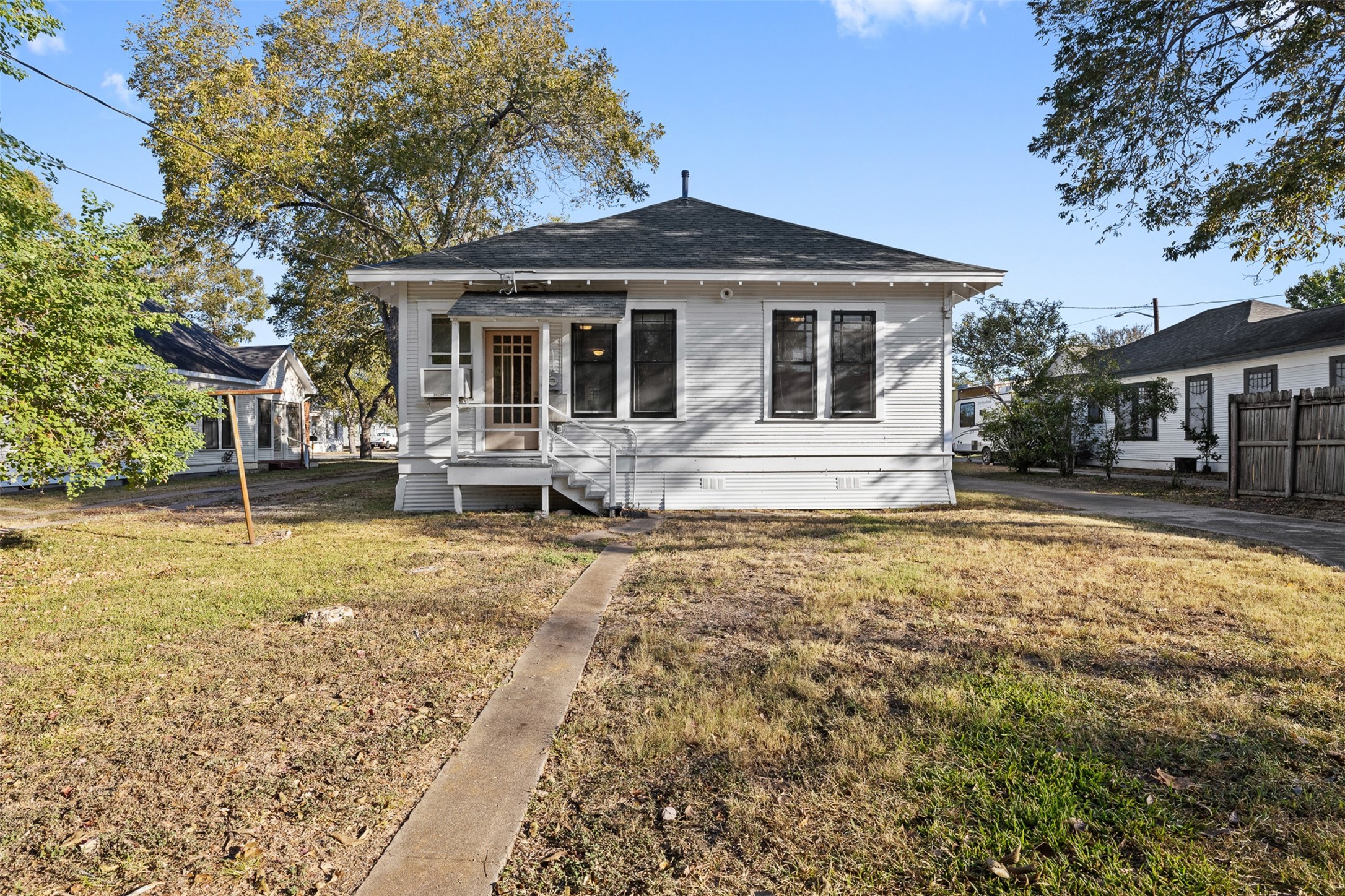 208 Summit Street Schulenburg, TX 78956 - Photo 24 of 26 a front view of a house with garden