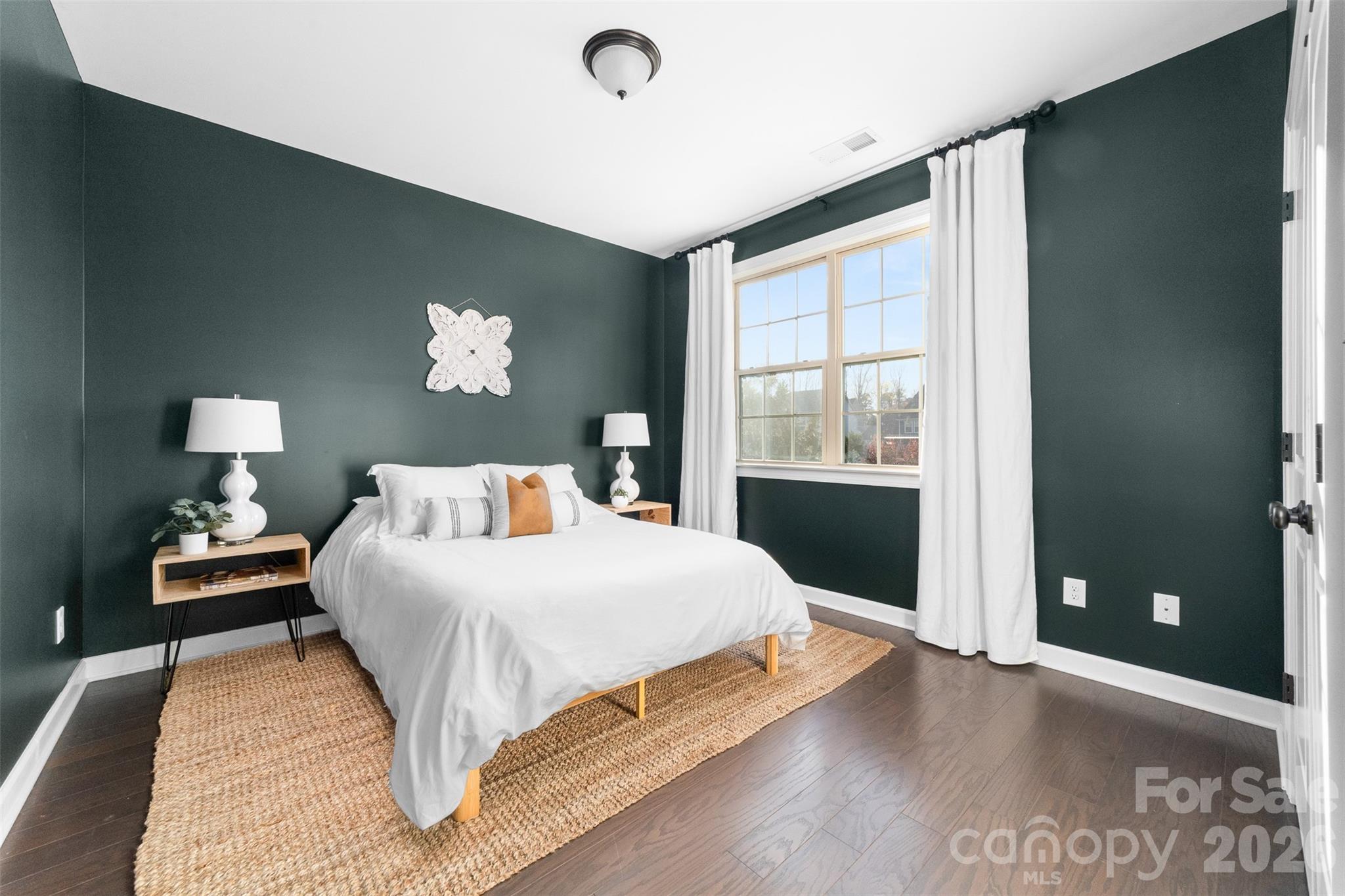 17549 Julees Walk Lane Davidson, NC 28036 - Photo 14 of 48 a bedroom with a large bed and a window