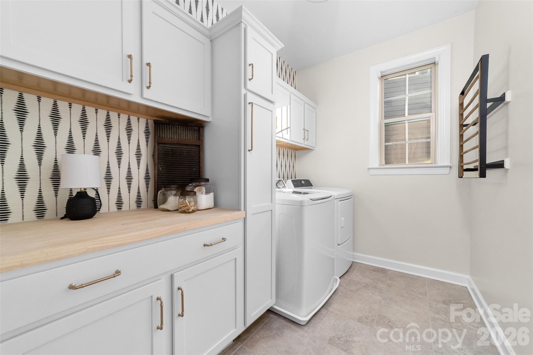 17549 Julees Walk Lane Davidson, NC 28036 - Photo 16 of 48 a kitchen with white cabinets and sink