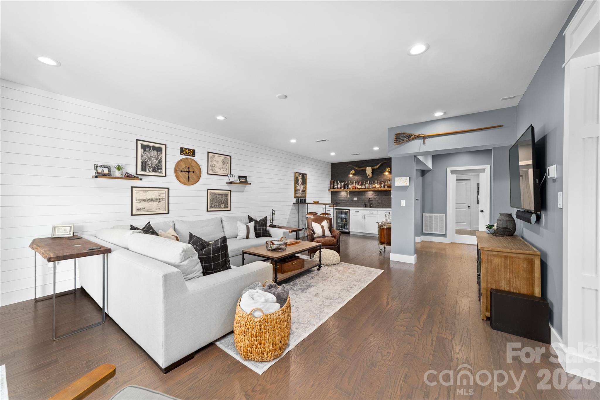 17549 Julees Walk Lane Davidson, NC 28036 - Photo 24 of 48 a living room with furniture and a flat screen tv