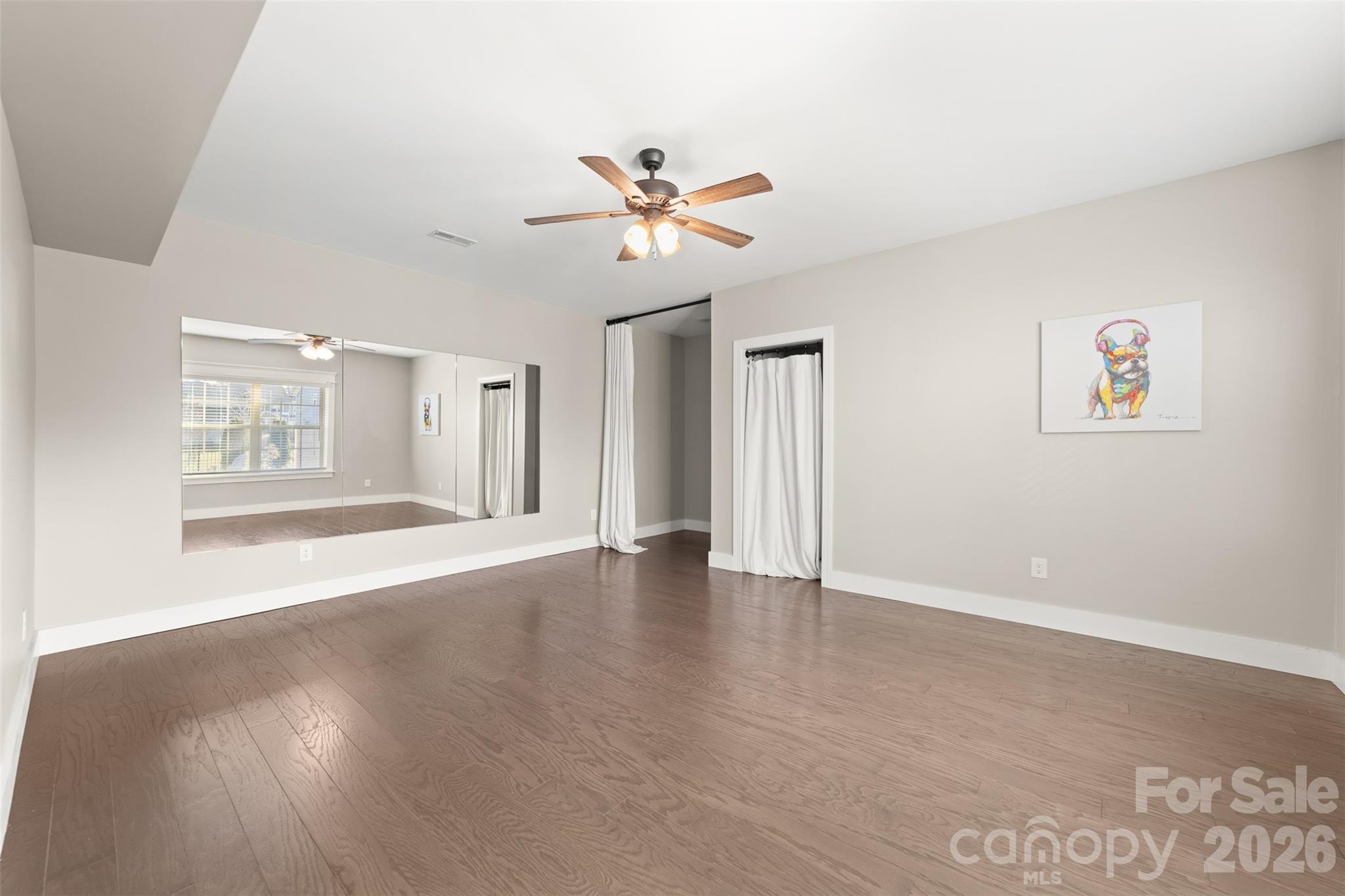 17549 Julees Walk Lane Davidson, NC 28036 - Photo 26 of 48 a view of an empty room with a window and wooden floor