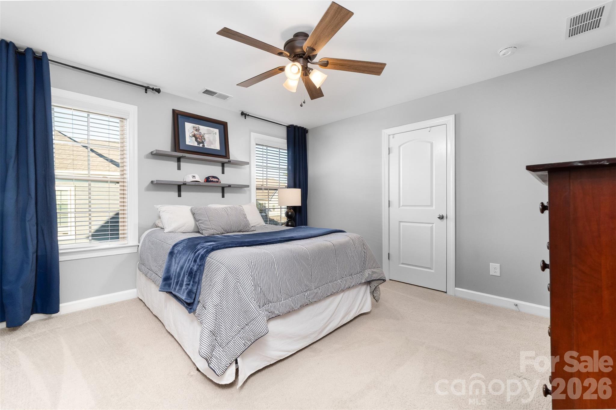 17549 Julees Walk Lane Davidson, NC 28036 - Photo 37 of 48 a spacious bedroom with a bed and a large window