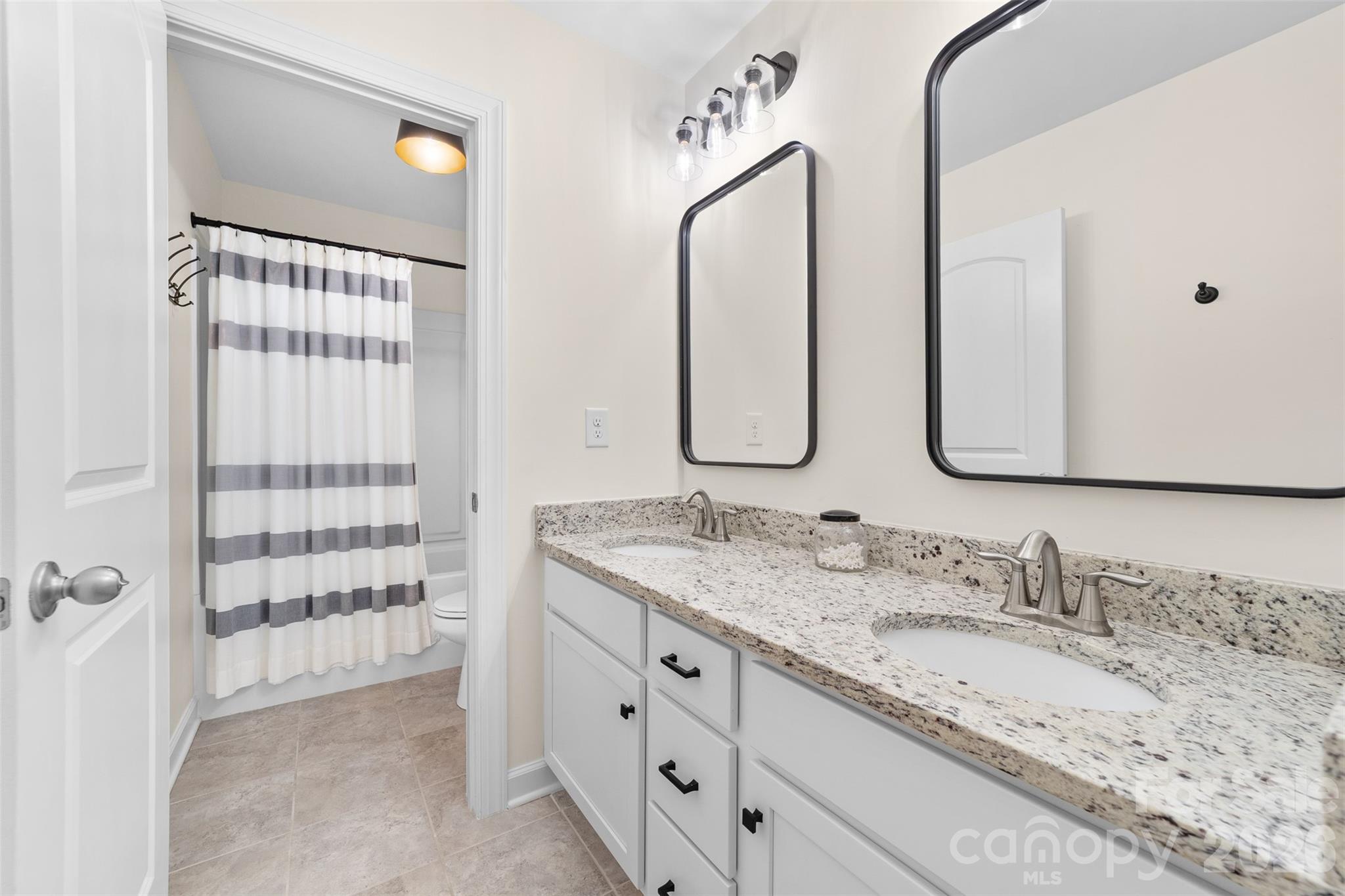 17549 Julees Walk Lane Davidson, NC 28036 - Photo 40 of 48 a bathroom with a granite countertop double vanity sink and mirror