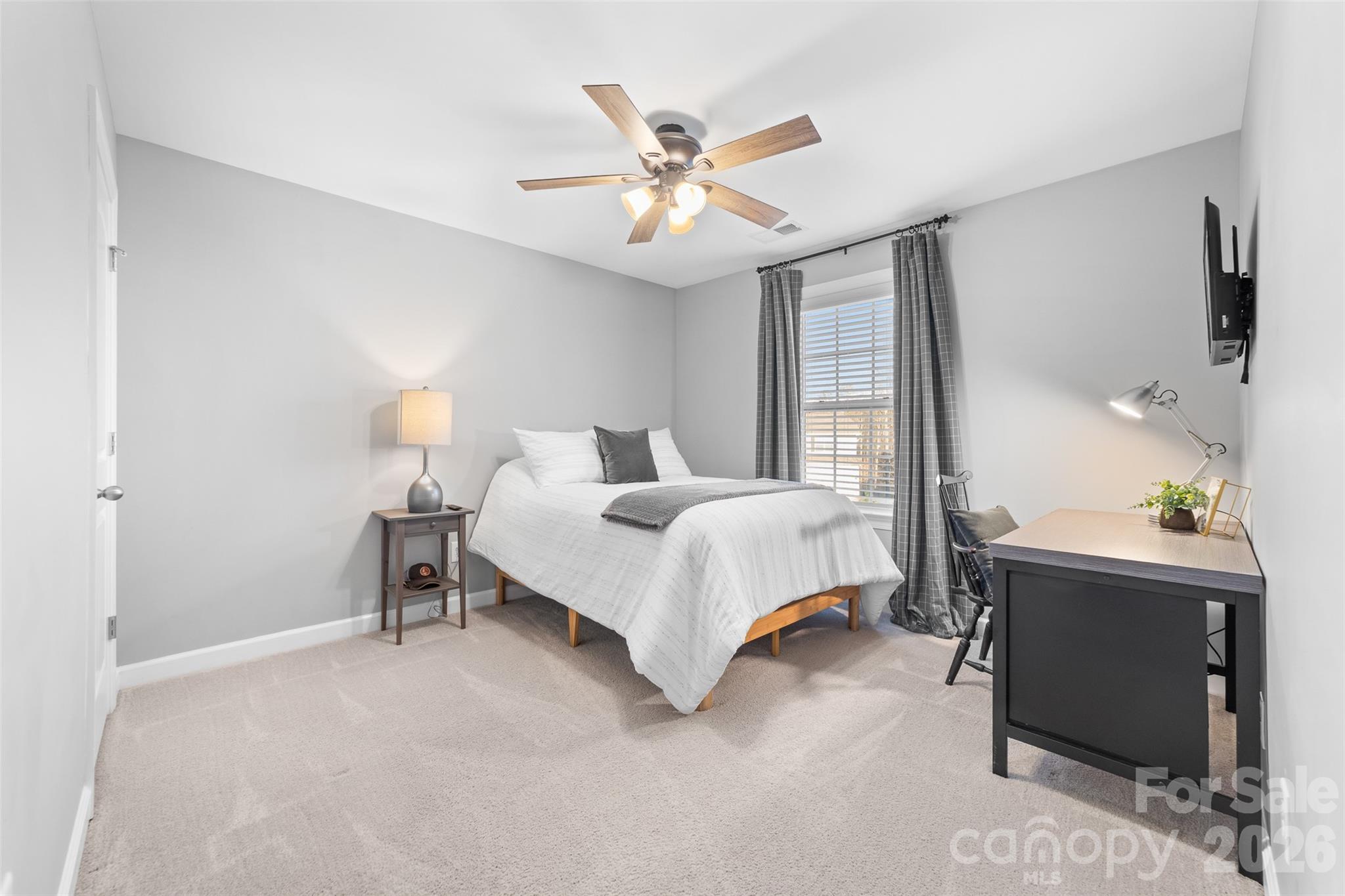 17549 Julees Walk Lane Davidson, NC 28036 - Photo 41 of 48 a bedroom with a bed and a chandelier