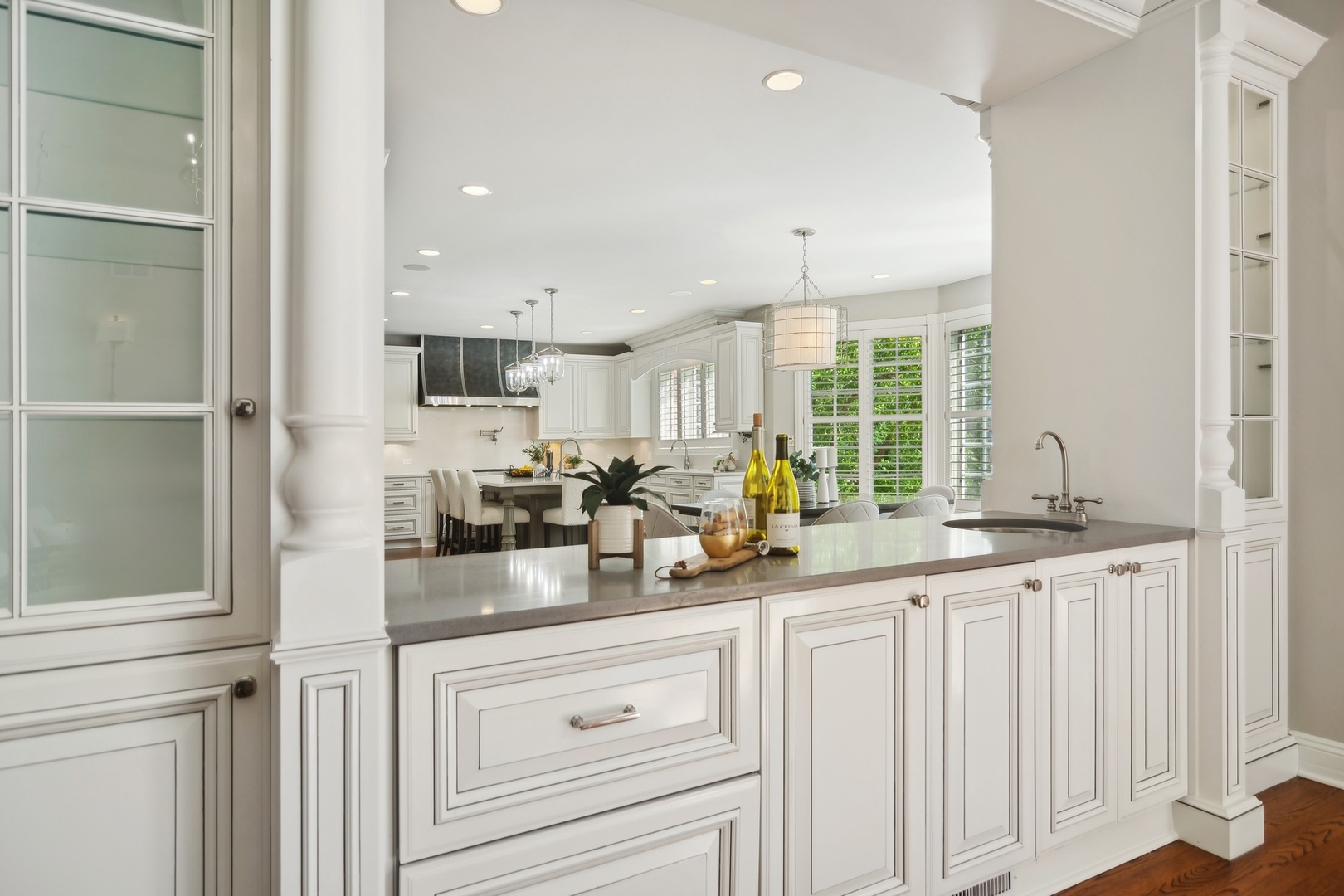 610 West Windsor Road Palatine, IL 60067 - Photo 12 of 51 a kitchen with granite countertop white cabinets and white appliances