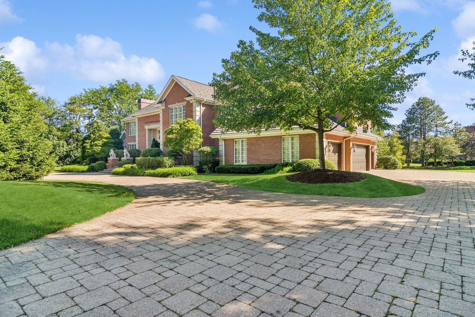 610 West Windsor Road Palatine, IL 60067 - Photo 2 of 51 a front view of a house with a yard and a garage