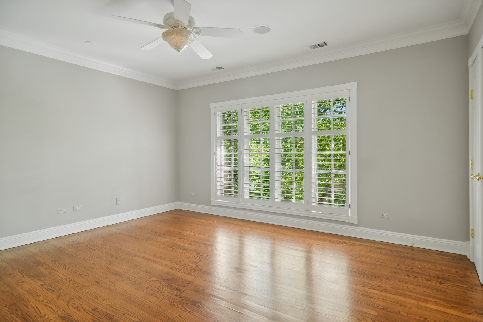 610 West Windsor Road Palatine, IL 60067 - Photo 26 of 51 a view of an empty room with wooden floor and a window