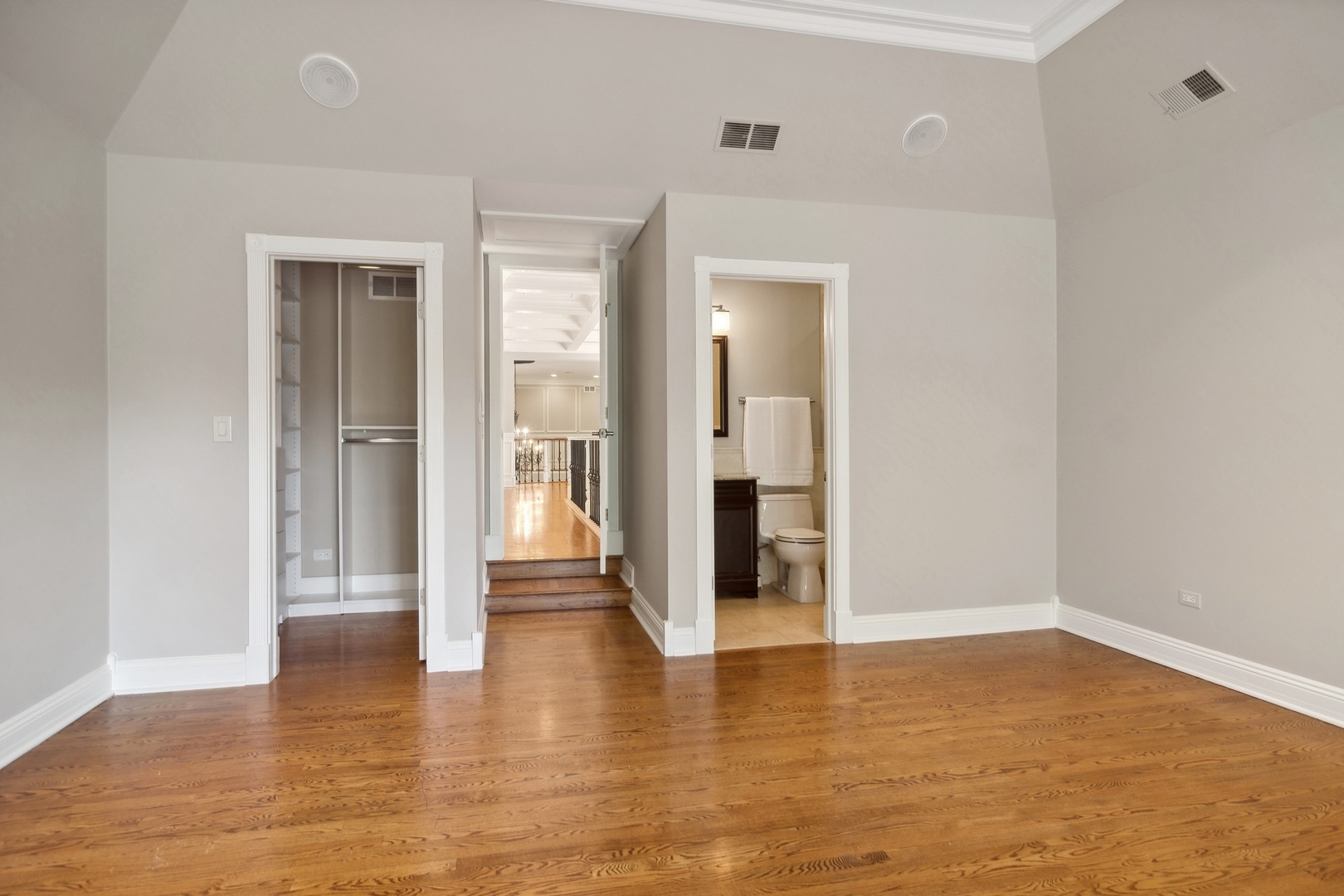610 West Windsor Road Palatine, IL 60067 - Photo 28 of 51 a view of an empty room with wooden floor and a bathroom