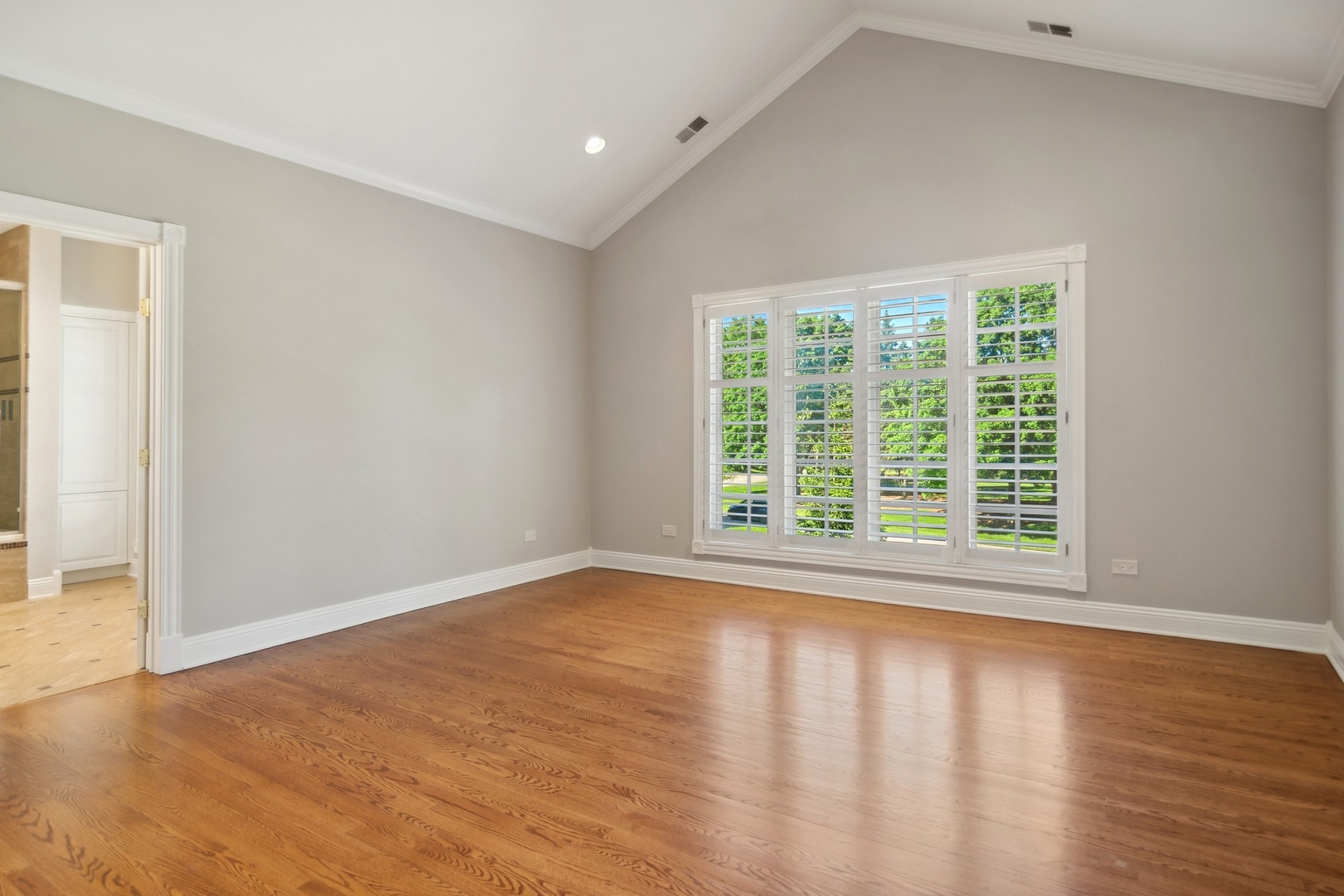 610 West Windsor Road Palatine, IL 60067 - Photo 29 of 51 a view of an empty room with wooden floor and a window