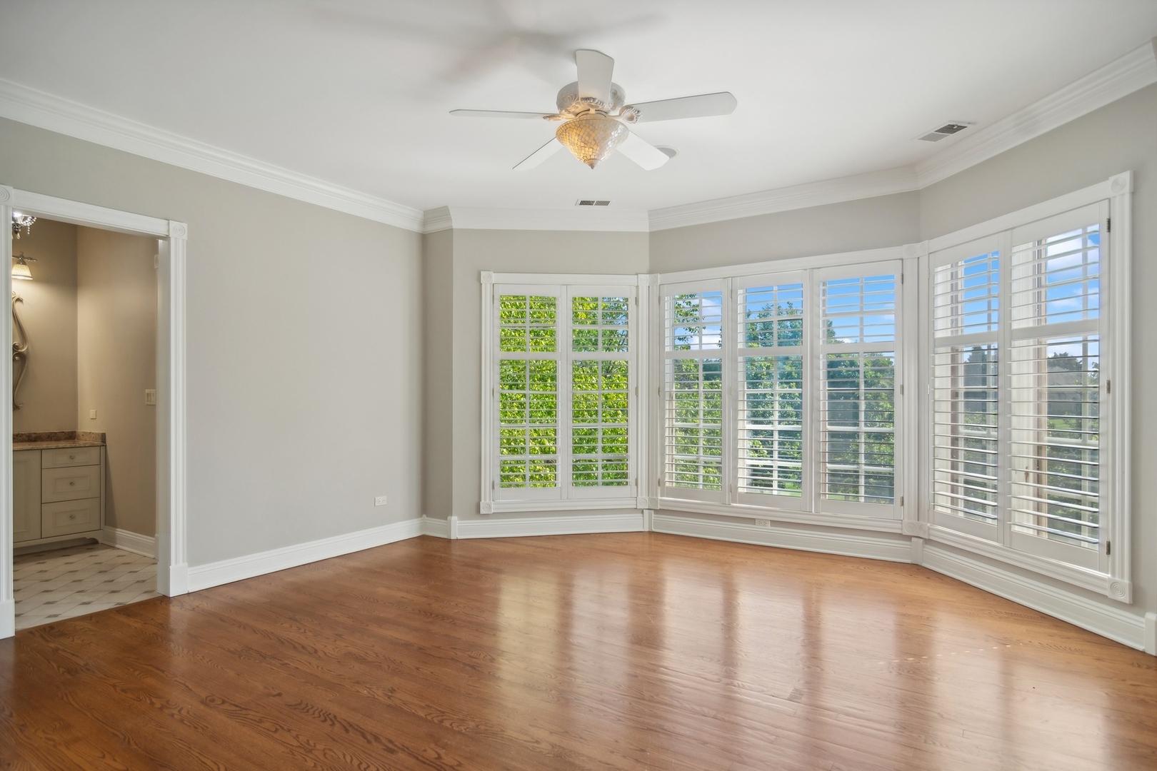 610 West Windsor Road Palatine, IL 60067 - Photo 30 of 51 a view of empty room with wooden floor and fan