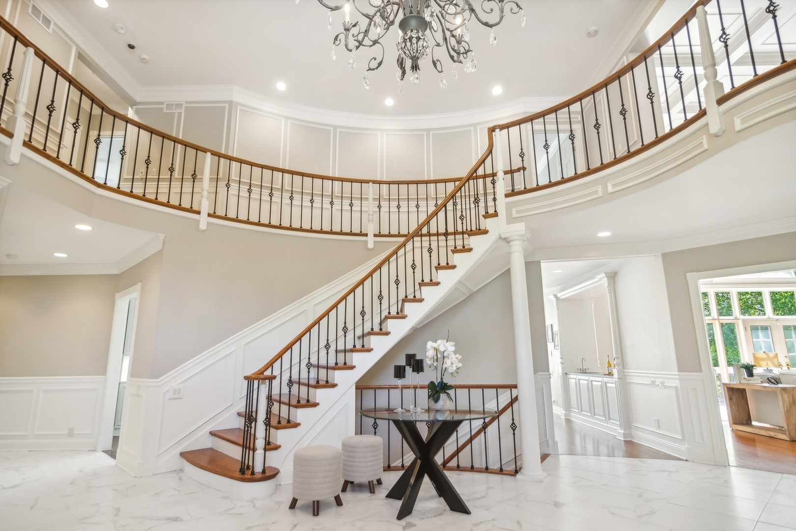 610 West Windsor Road Palatine, IL 60067 - Photo 3 of 51 a view of staircase with lots of frames on wall and windows