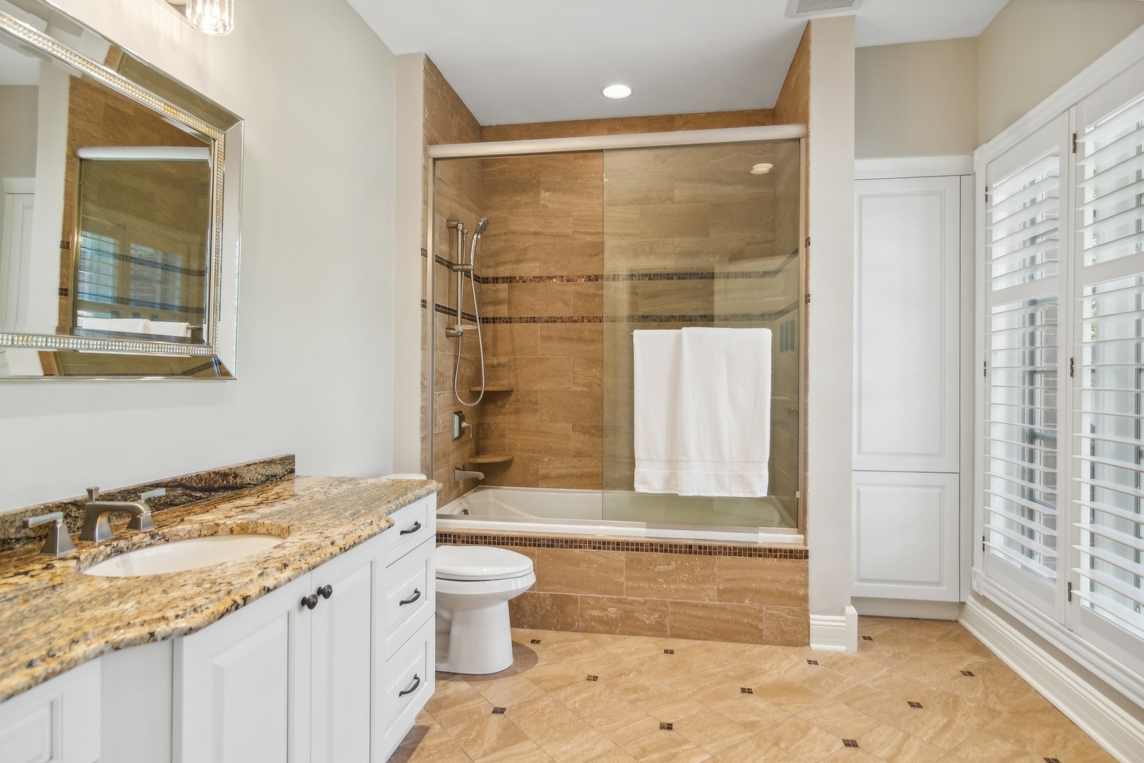 610 West Windsor Road Palatine, IL 60067 - Photo 33 of 51 a bathroom with a granite countertop sink toilet and shower