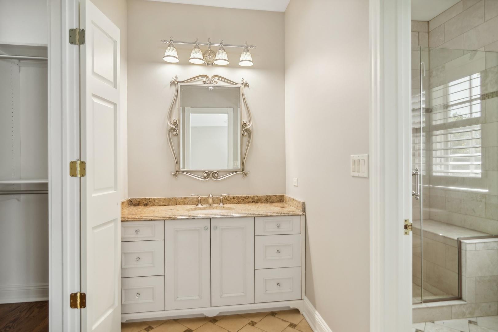 610 West Windsor Road Palatine, IL 60067 - Photo 34 of 51 a bathroom with a sink a vanity and a mirror