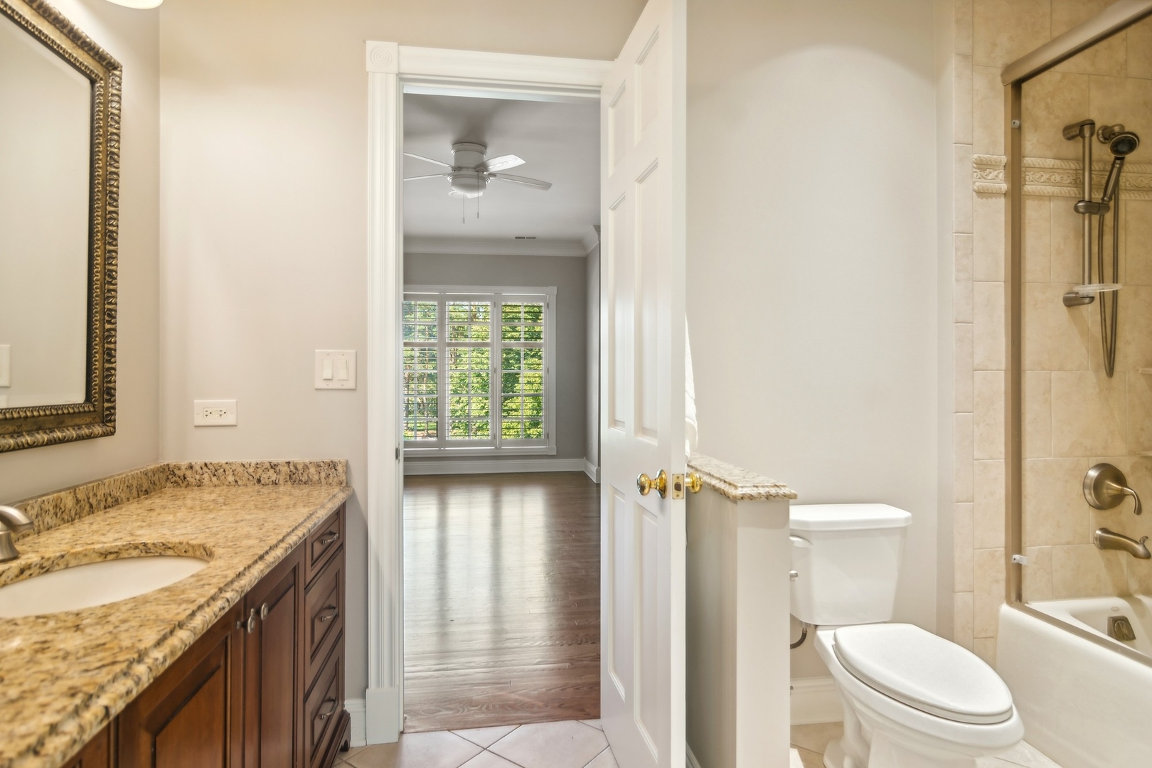 610 West Windsor Road Palatine, IL 60067 - Photo 35 of 51 a bathroom with a granite countertop sink toilet and shower