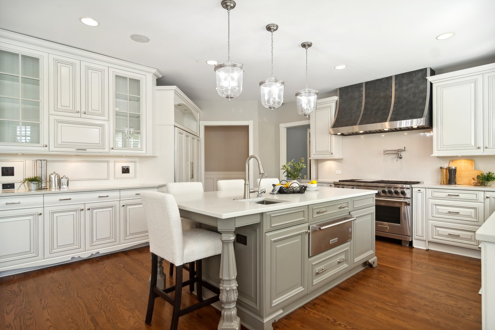 610 West Windsor Road Palatine, IL 60067 - Photo 9 of 51 a kitchen with stainless steel appliances kitchen island granite countertop a sink a stove and a wooden floors
