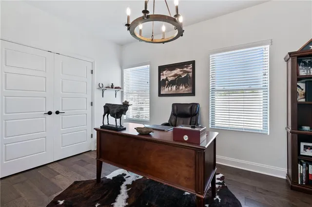 a work room with furniture and a window