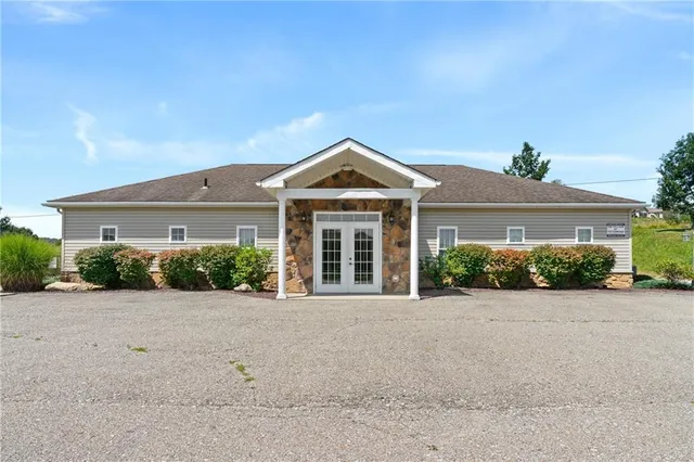 front view of a house with a small yard