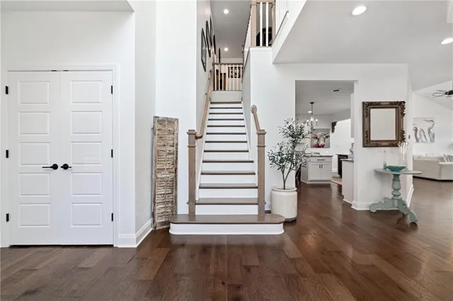 a view of a living room and hallway with wooden floor