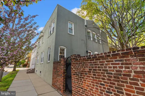 a living room with furniture fireplace and dining room